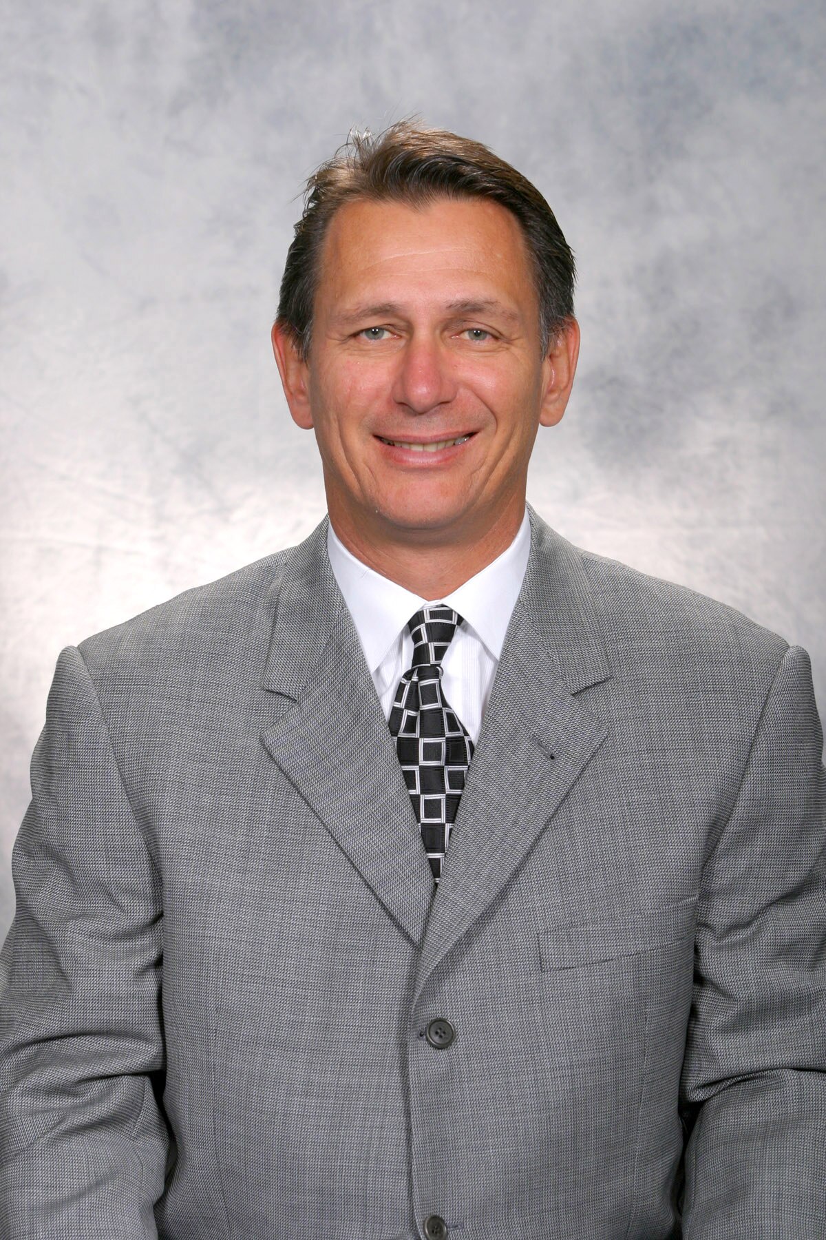 DETROIT - SEPTEMBER 14:  Ken Holland of the Detroit Red Wings poses for a portrait at Joe Louis Arena on September 14, 2006 in Detroit, Michigan.  (Photo by Getty Images)