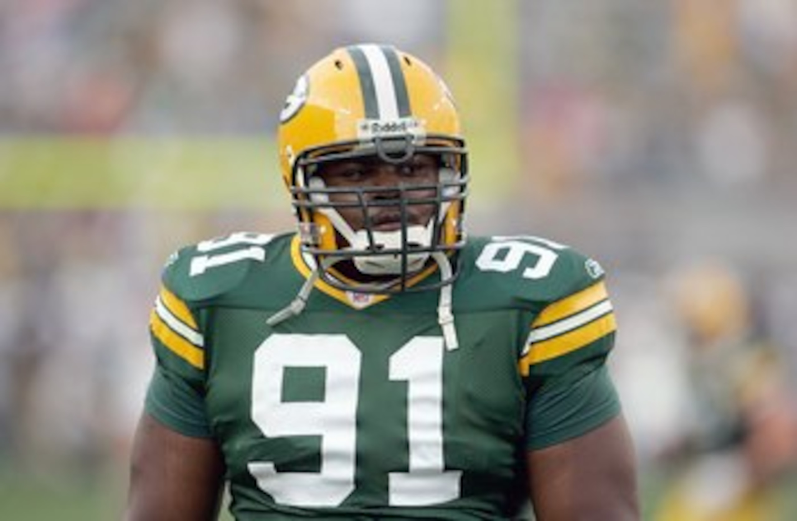 GREEN BAY, WI - AUGUST 23:  Justin Harrell #91 of the Green Bay Packers looks on before the game against the Jacksonville Jaguars on August 23, 2007 at Lambeau Field in Green Bay, Wisconsin. (Photo by Jonathan Daniel/Getty Images)