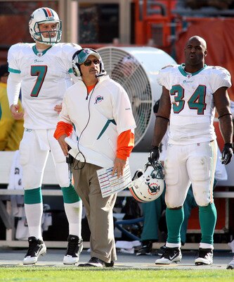 MIAMI - DECEMBER 26: (L-R) Quarterback Chad Henne #7, coach Tony Sparano and running back Ricky Williams #34 of the Miami Dolphins look on from the sidelines against the Detroit Lions at Sun Life Stadium on December 26, 2010 in Miami, Florida.  (Photo by 