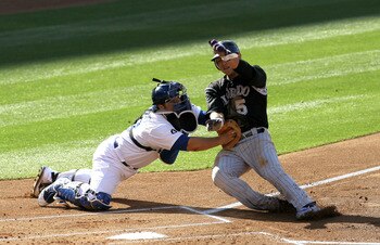 LOS ANGELES, CA - MAY 30:  Catcher Rod Barajas #28 of the Los Angeles Dodgers tags out Carlos Gonzalez #5 of the Colorado Rockies at home plate on May 30, 2011 at Dodger Stadium in Los Angeles, California.  (Photo by Stephen Dunn/Getty Images)