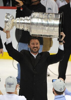 DETROIT - JUNE 12:  Mario Lemieux of the Pittsburgh Penguins celebrates with the Stanley Cup after defeating the Detroit Red Wings by a score of 2-1 to win Game Seven and the 2009 NHL Stanley Cup Finals at Joe Louis Arena on June 12, 2009 in Detroit, Mich