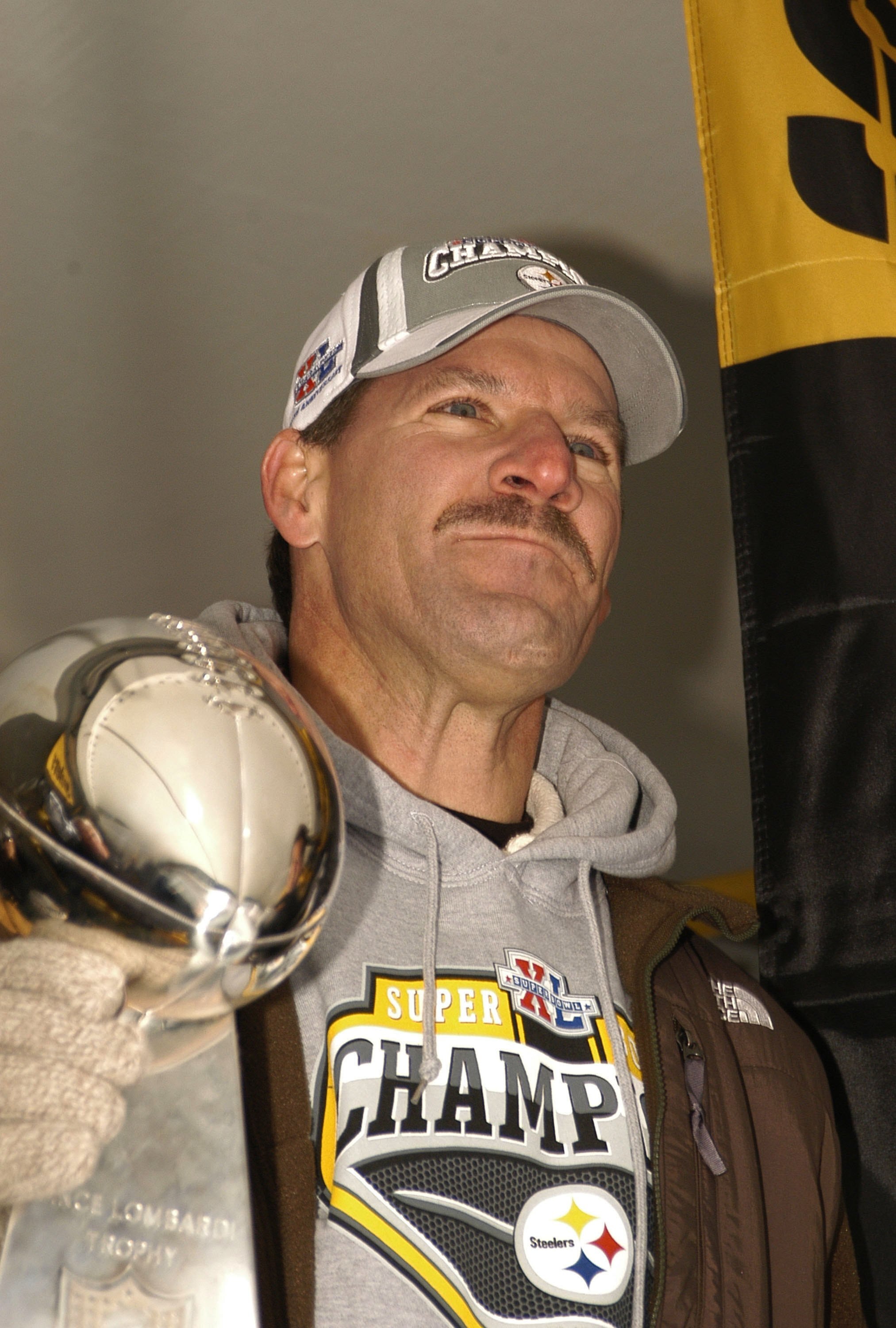 PITTSBURGH, PA - FEBRUARY 7:  Pittsburgh Steelers head coach Bill Cowher pauses before speaking to the crowd gathered at the end of  victory parade celebrating winning Super Bowl XL February 7, 2006 in downtown Pittsburgh Pennsylvania.  (Photo by Archie C