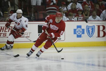 RALEIGH, NC - JUNE 8:  Center Sergei Fedorov #91 of the Detroit Red Wings looks to play the puck at the blueline against the Carolina Hurricanes during game three of the NHL Stanley Cup Finals at the Entertainment and Sports Arena in Raleigh, North Caroli