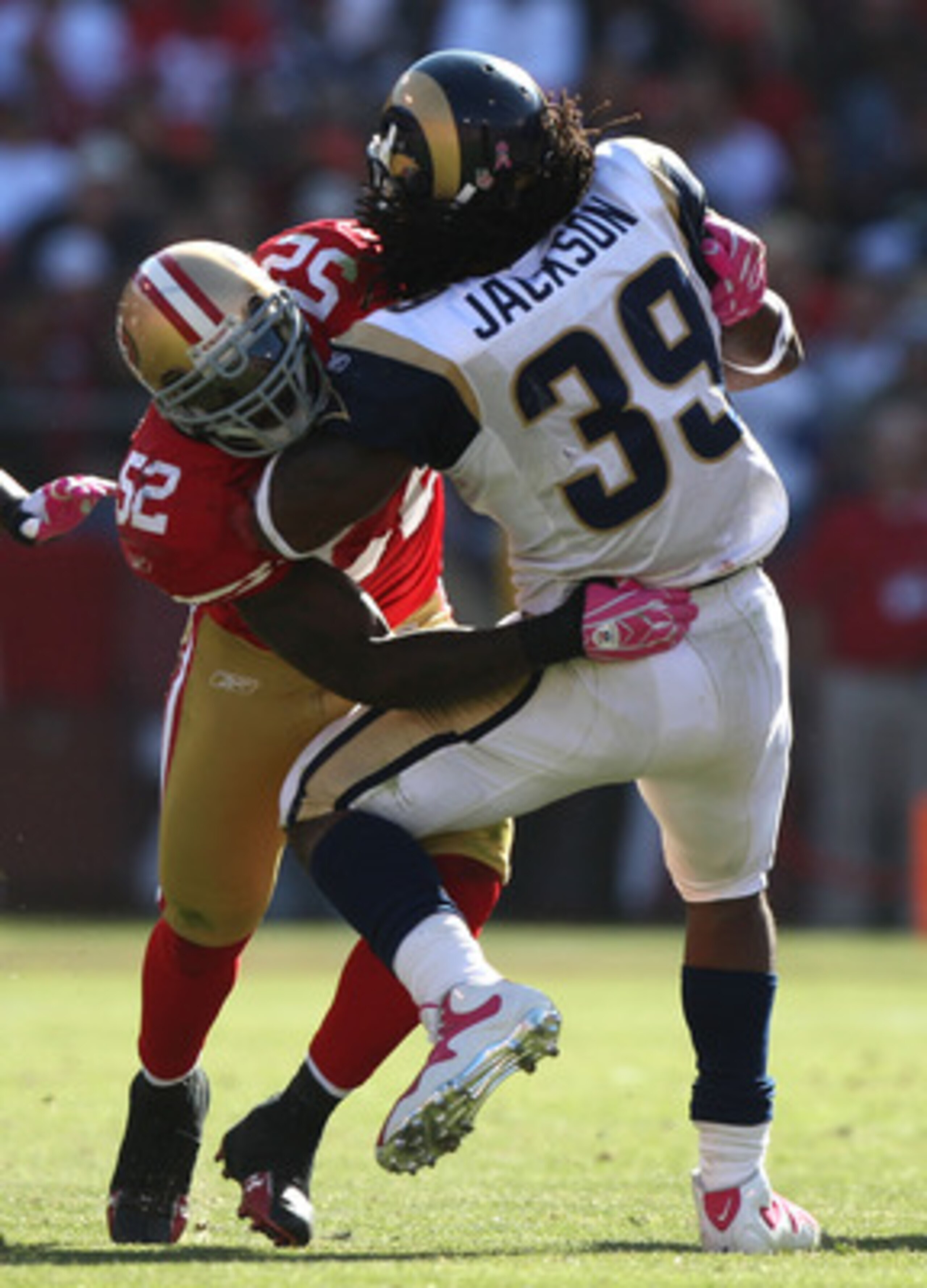 SAN FRANCISCO - OCTOBER 04: Patrick Willis #52 of the San Francisco 49ers tackles Steven Jackson #39 of the St. Louis Rams during an NFL game on October 4, 2009 at Candlestick Park in San Francisco, California.  (Photo by Jed Jacobsohn/Getty Images)