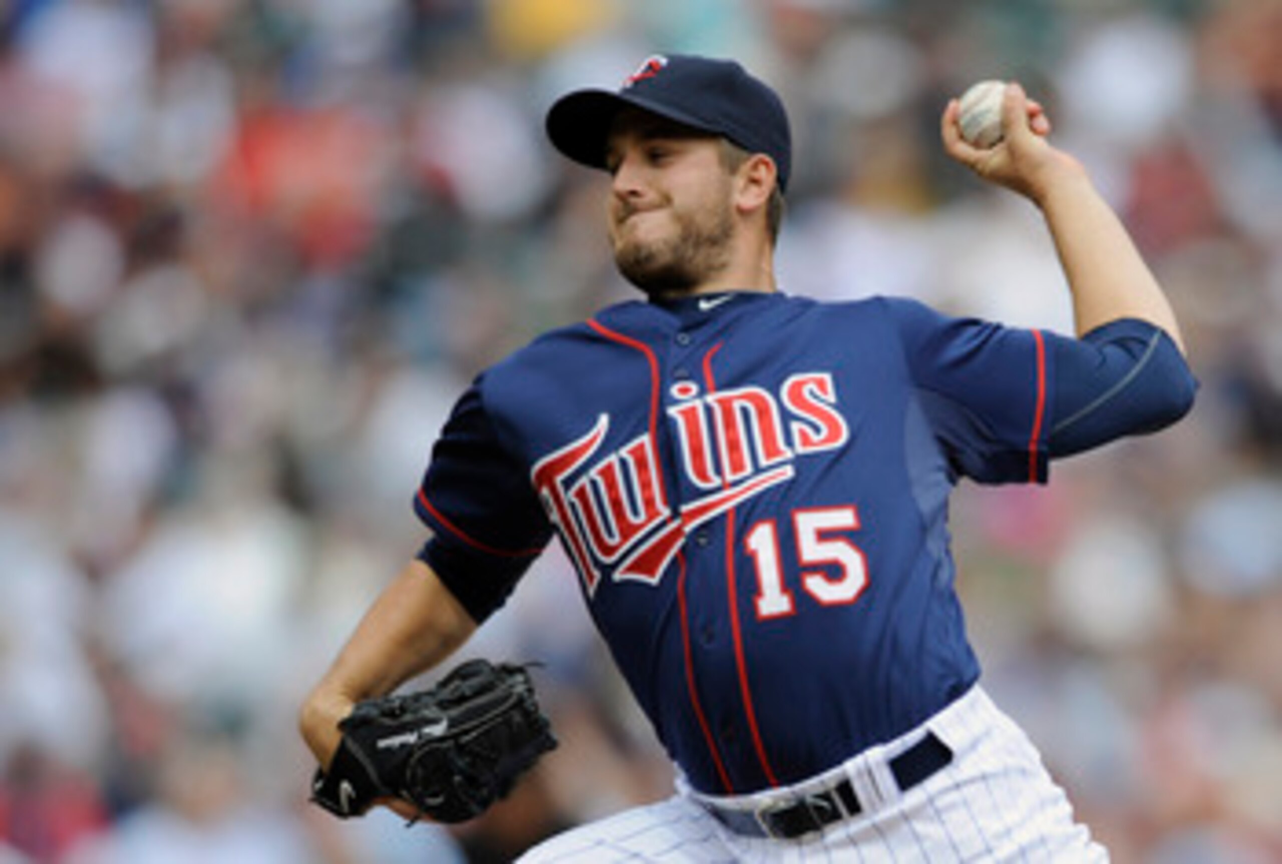 MINNEAPOLIS, MN - APRIL 13: Glen Perkins #15 of the Minnesota Twins pitches against the Kansas City Royals during the seventh inning of their game on April 13, 2011 at Target Field in Minneapolis, Minnesota. Royals defeated the Twins 10-5. (Photo by Hanna