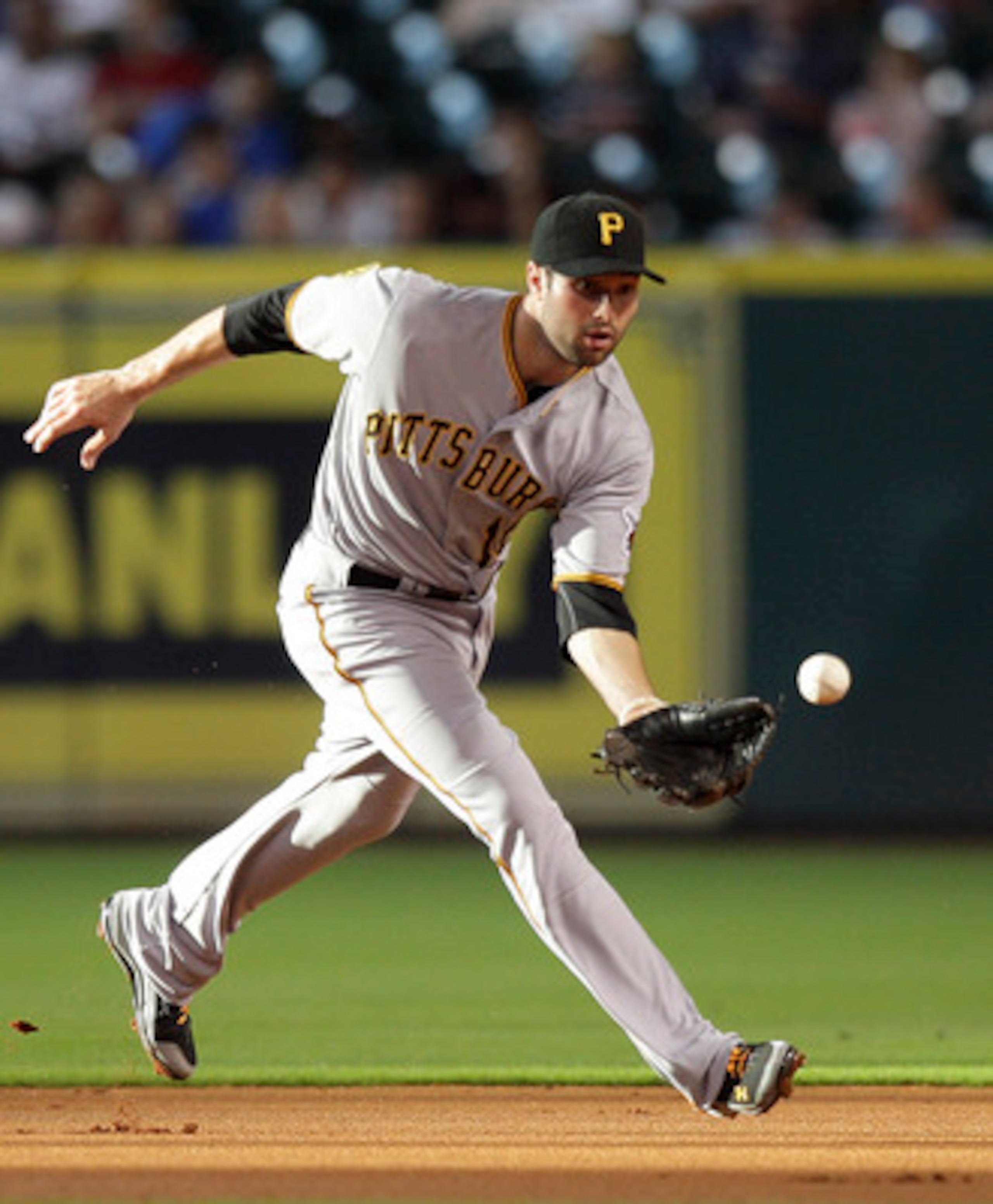 HOUSTON - JUNE 15:  Second baseman Neil Walker #18 of the Pittsburgh Pirates makes a play on a ground ball against the Houston Astros at Minute Maid Park on June 15, 2011 in Houston, Texas.  (Photo by Bob Levey/Getty Images)