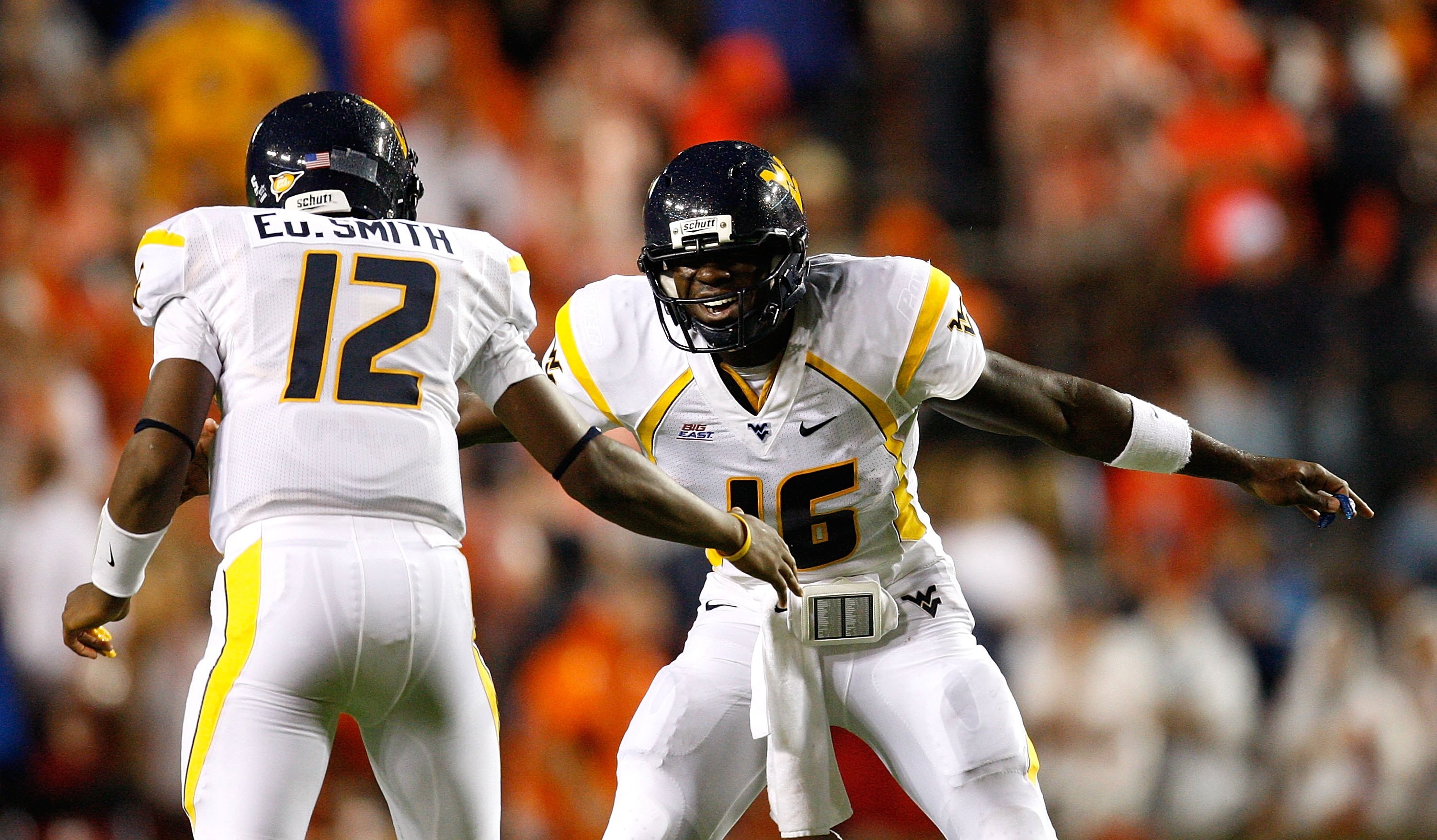 AUBURN, AL - SEPTEMBER 19:  Quarterback Jarrett Brown #16 and J.D. Woods #12 of the West Virginia Mountaineers against the Auburn Tigers at Jordan-Hare Stadium on September 19, 2009 in Auburn, Alabama.  (Photo by Kevin C. Cox/Getty Images)