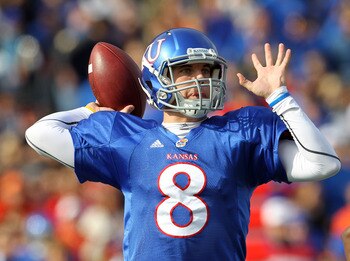 LAWRENCE, KS - NOVEMBER 20:  Quarterback Quinn Mecham #8 of the Kansas Jayhawks passes  during the game against the Oklahoma State Cowboys on November 20, 2010 at Memorial Stadium in Lawrence, Kansas.  (Photo by Jamie Squire/Getty Images)