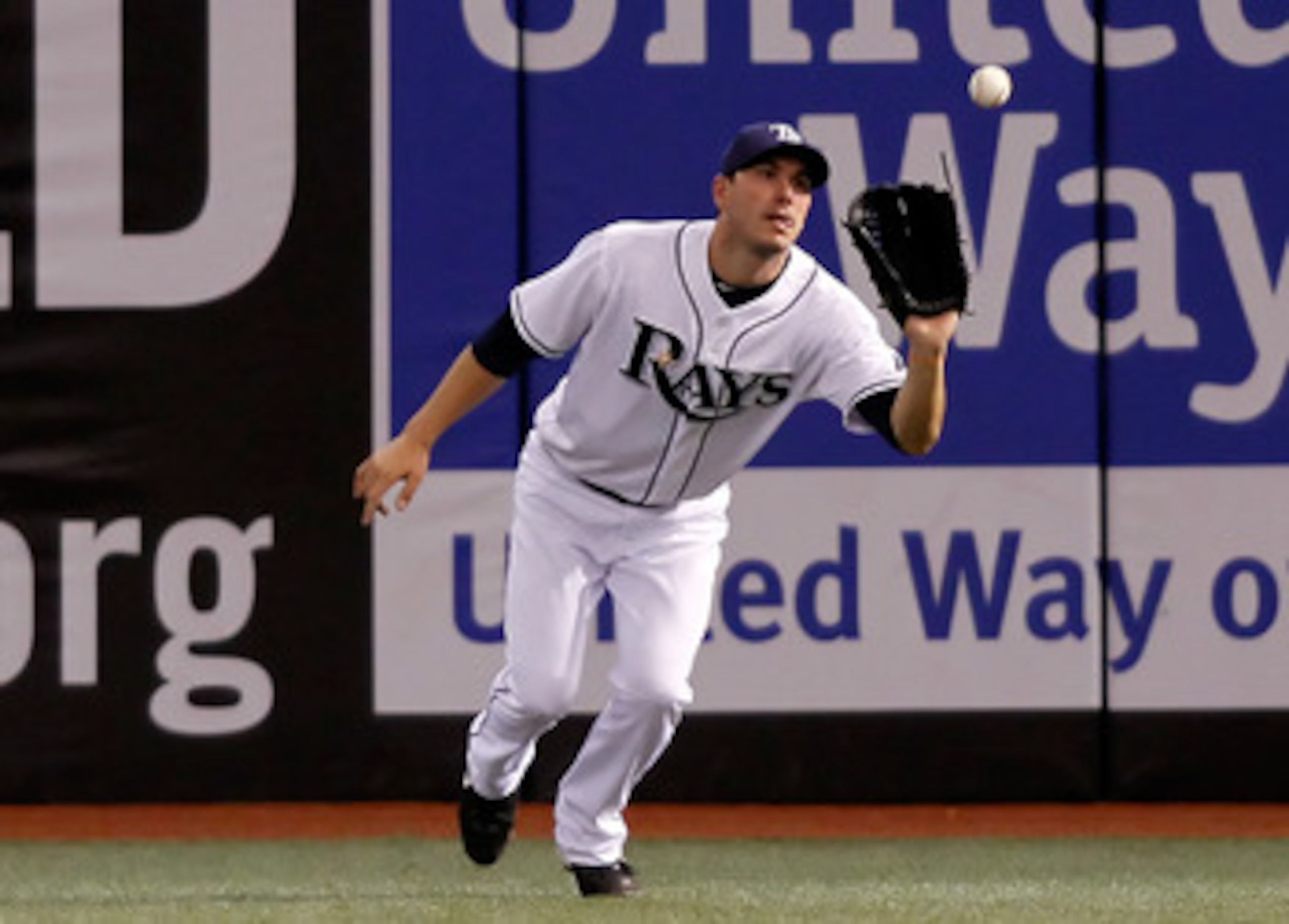 ST. PETERSBURG - AUGUST 17:  Outfielder Matt Joyce #20 of the Tampa Bay Rays catches a fly ball against the Texas Rangers during the game at Tropicana Field on August 17, 2010 in St. Petersburg, Florida.  (Photo by J. Meric/Getty Images)