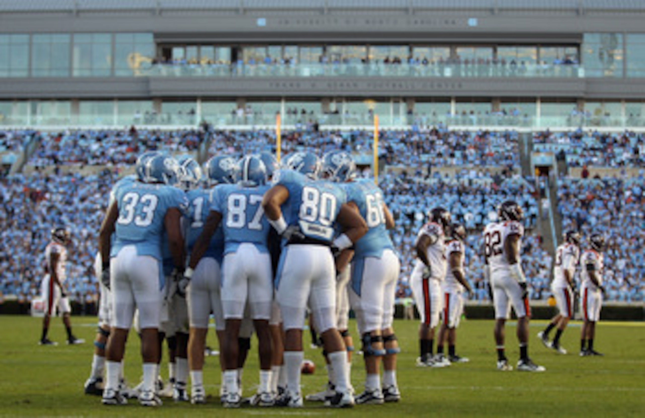 CHAPEL HILL, NC - NOVEMBER 13:  The North Carolina Tar Heels huddle against the Virginia Tech Hokies during their game at Kenan Stadium on November 13, 2010 in Chapel Hill, North Carolina.  (Photo by Streeter Lecka/Getty Images)