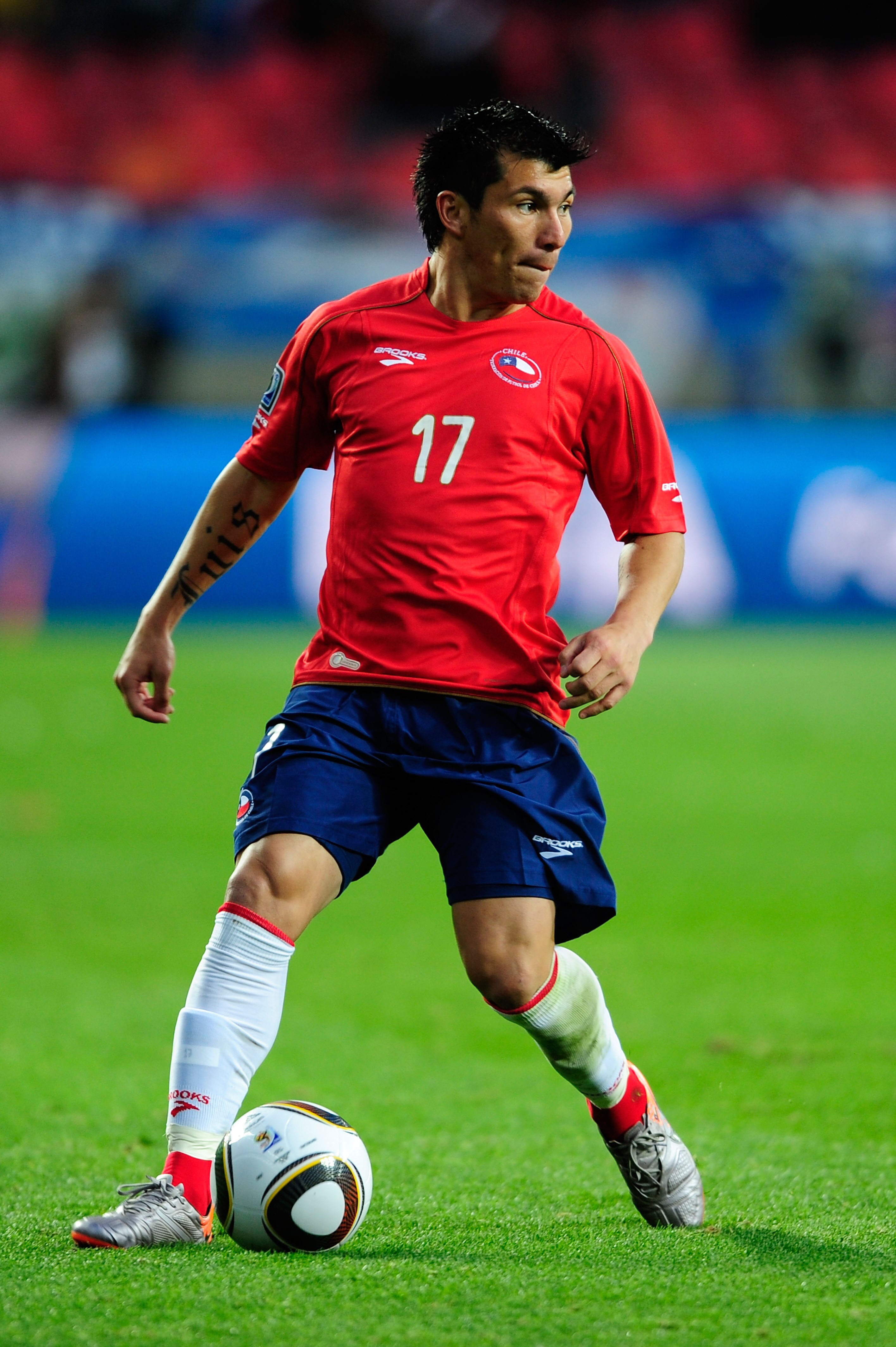 PORT ELIZABETH, SOUTH AFRICA - JUNE 21:  Gary Medel of Chile runs with the ball during the 2010 FIFA World Cup South Africa Group H match between Chile and Switzerland at Nelson Mandela Bay Stadium on June 21, 2010 in Port Elizabeth, South Africa.  (Photo