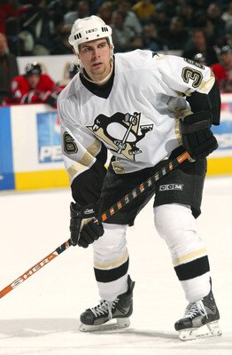 BUFFALO, NY - NOVEMBER 14:  Right wing Tom Kostopoulos #26 of the Pittsburgh Penguins stands on the ice during the game against the Buffalo Sabres at HSBC Arena on November 14, 2003 in Buffalo, New York.  The Penguins won 2-1, in overtime.  (Photo by Rick