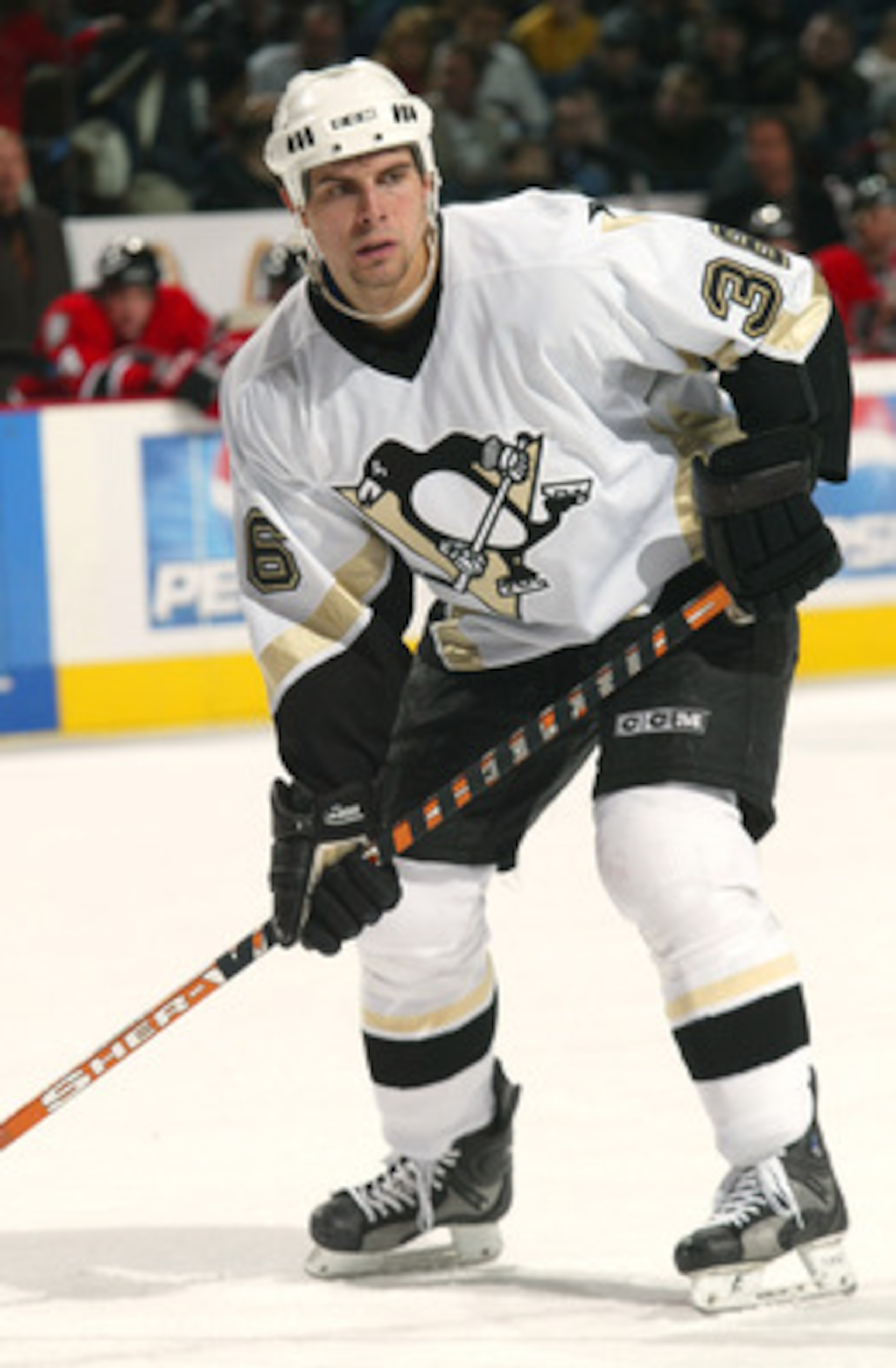 BUFFALO, NY - NOVEMBER 14:  Right wing Tom Kostopoulos #26 of the Pittsburgh Penguins stands on the ice during the game against the Buffalo Sabres at HSBC Arena on November 14, 2003 in Buffalo, New York.  The Penguins won 2-1, in overtime.  (Photo by Rick