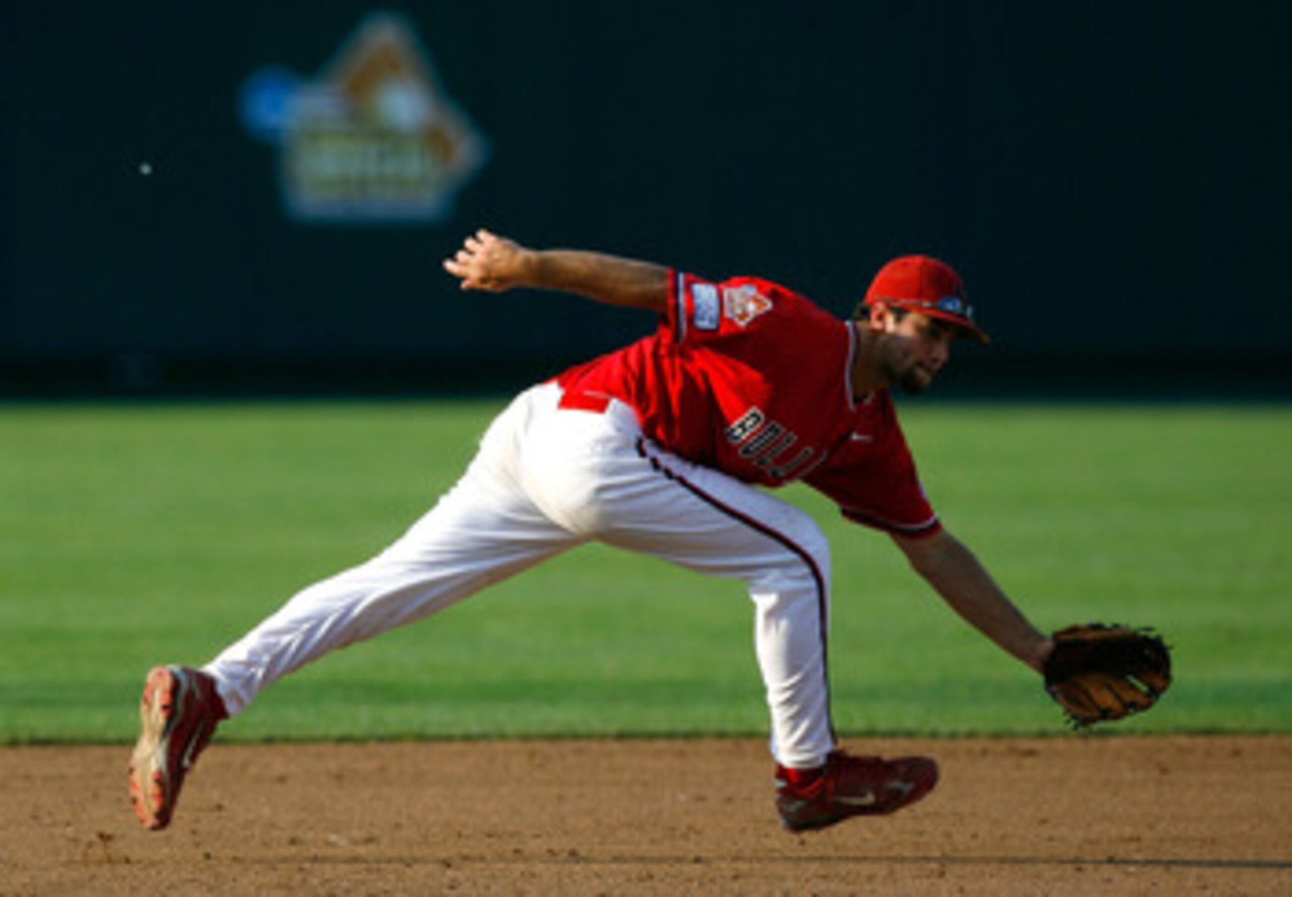 OMAHA, NE - JUNE 25:  Tommy Mendonca #32 of the Fresno State Bulldogs reaches for a ground ball against the Georgia Bulldogs during Game 3 of the 2008 Men's College World Series Championship June 25, 2008 at Rosenblatt Stadium in Omaha, Nebraska.   Fresno