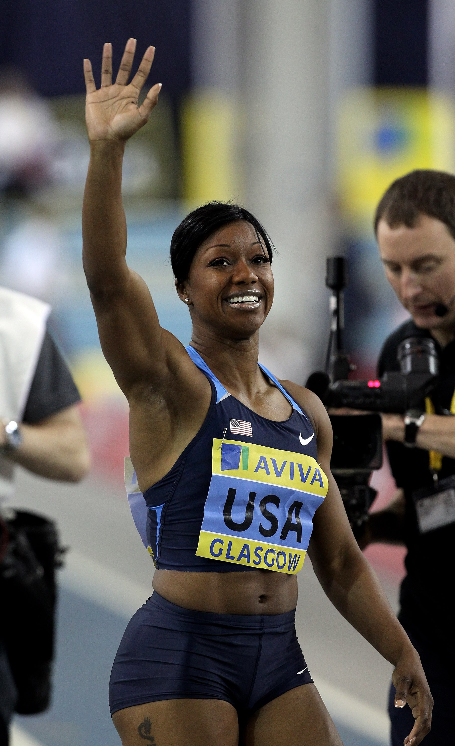 GLASGOW, SCOTLAND - JANUARY 30:  Carmelita Jeter of USA wins the Womens 60M during the Aviva International Athletics Match at Kelvin Hall on January 30, 2010 in Glasgow, Scotland.  (Photo by John Gichigi/Getty Images)