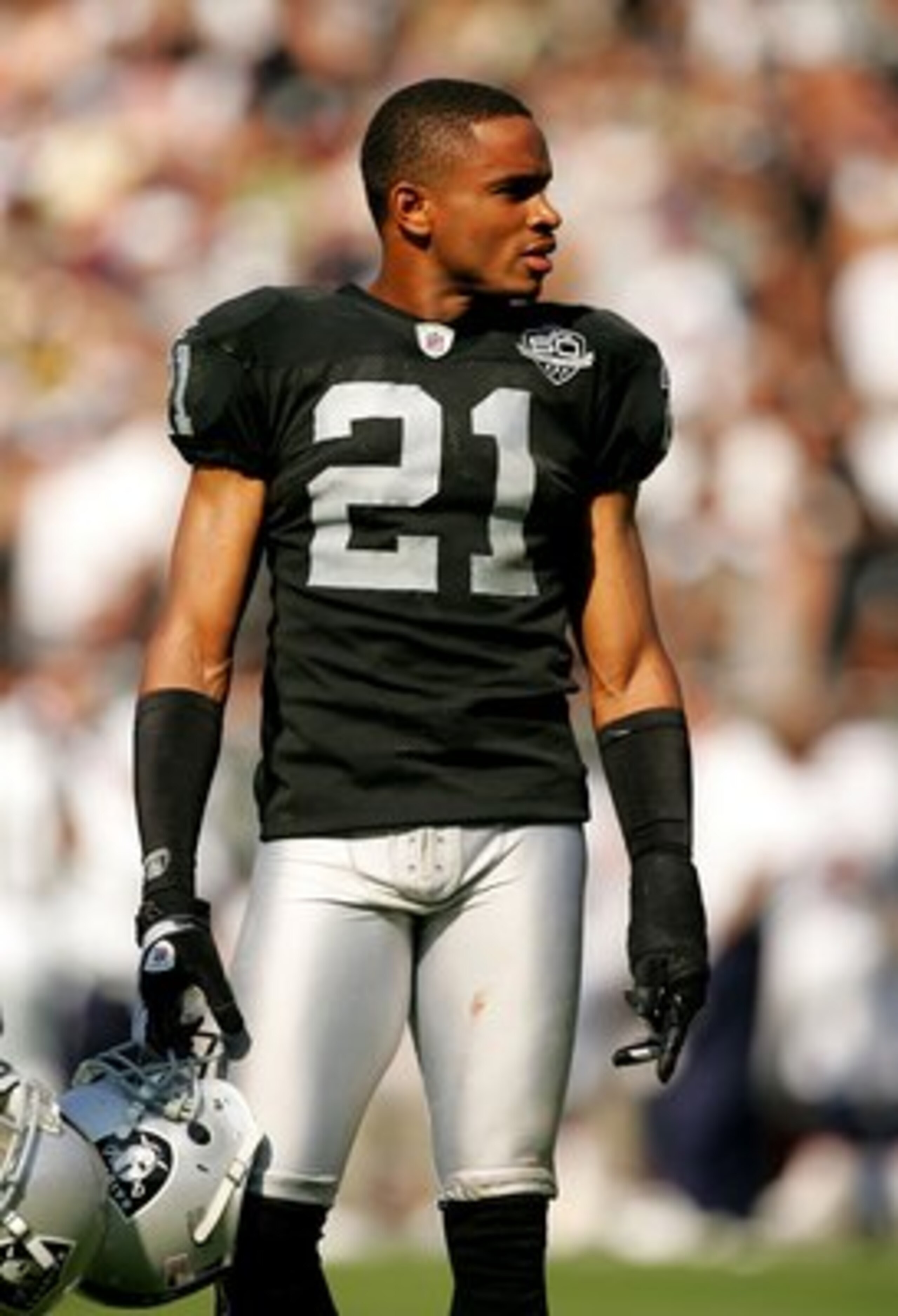 OAKLAND, CA - SEPTEMBER 27: Nnamdi Asomugha #21 takes off his helmet during a break in play in their game against the Denver Broncos at the Oakland-Alameda County Coliseum on September 27, 2009 in Oakland, California. (Photo by Ezra Shaw/Getty Images) OAKLAND, CA - SEPTEMBER 27: Nnamdi Asomugha #21 takes off his helmet during a break in play in their game against the Denver Broncos at the Oakland-Alameda County Coliseum on September 27, 2009 in Oakland, California. (Photo by Ezra Shaw/Getty Images)