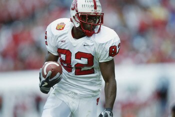 JACKSONVILLE, FL - JANUARY 1:  Wide Receiver Jerricho Cotchery #82 of the North Carolina State University Wolfpack runs for yards against the Notre Dame Fighting Irish in the Toyota Gator Bowl at Alltel Stadium on January 1, 2003 in Jacksonville, Florida.