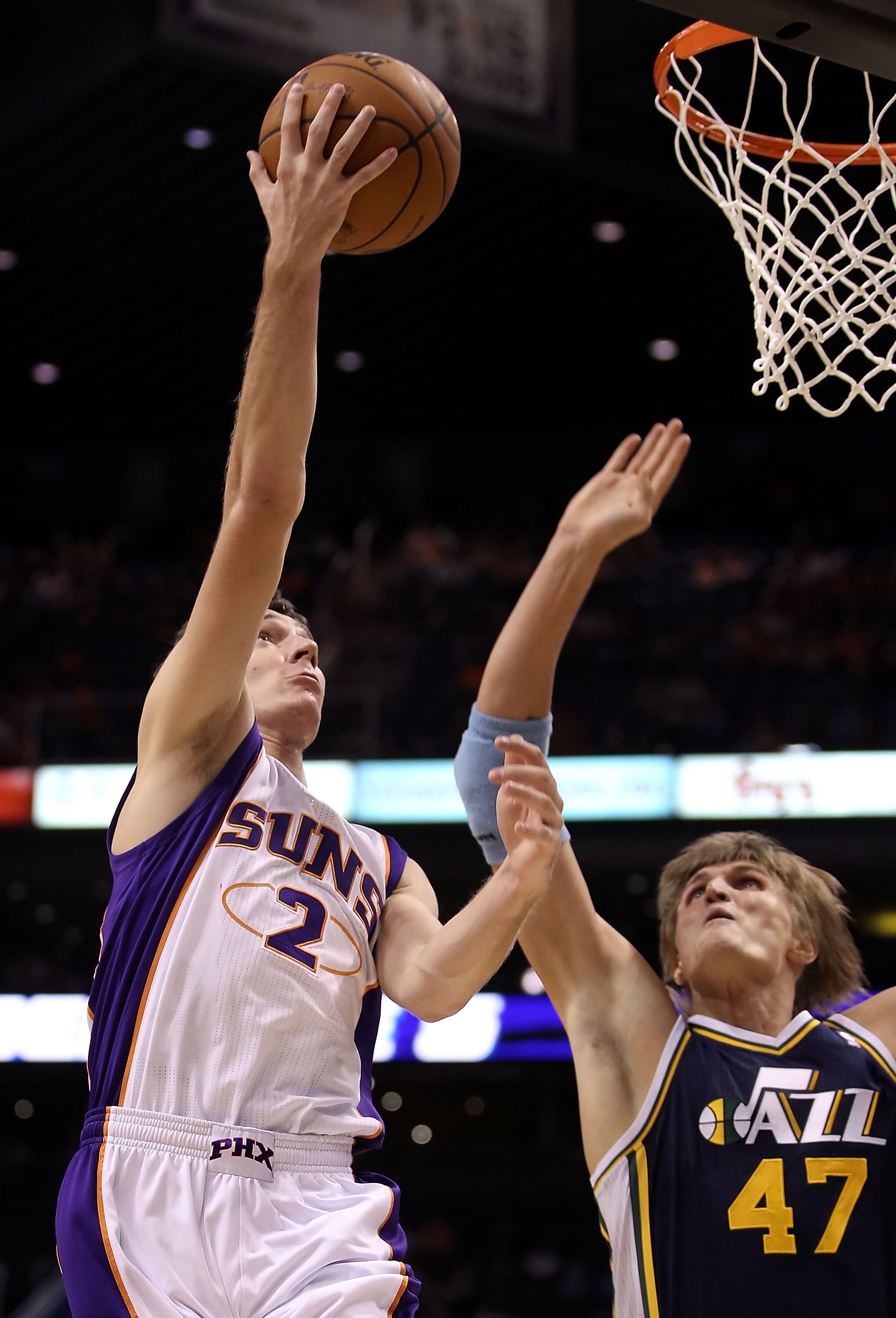 PHOENIX - OCTOBER 12:  Goran Dragic #2 of the Phoenix Suns lays up a shot over Andrei Kirilenko #47 of the Utah Jazz during the preseason NBA game at US Airways Center on October 12, 2010 in Phoenix, Arizona. NOTE TO USER: User expressly acknowledges and