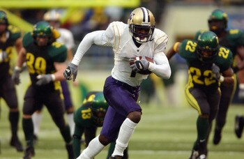 EUGENE - NOVEMBER 16:  Wide Receiver Reggie Williams #1 of the Washington Huskies scores a touchdown on this run in the fourth quarter against the Oregon Ducks during their game on November 16, 2002 at Autzen Stadium in Eugene Oregon. (Photo by Otto Greul