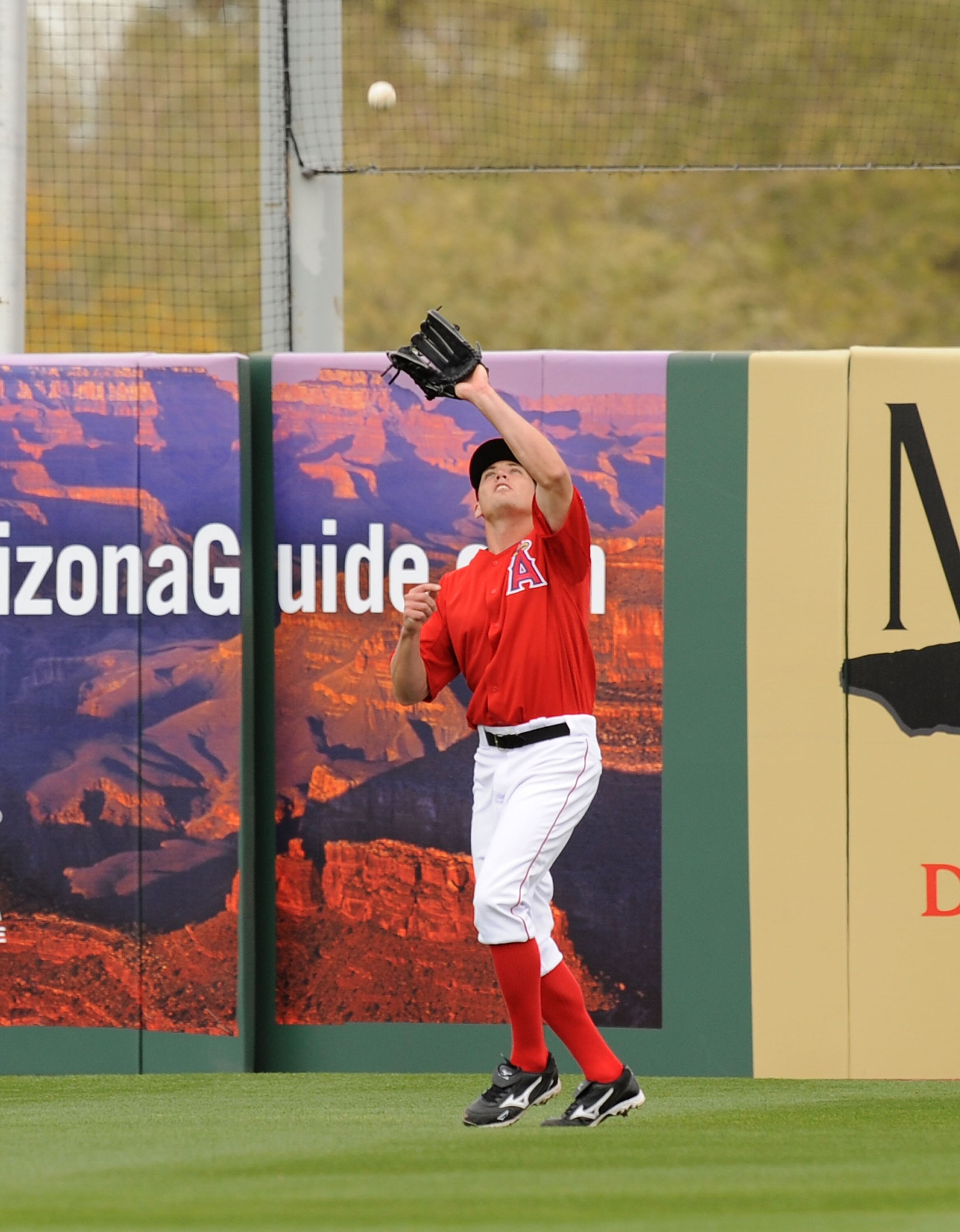 TEMPE, AZ - FEBRUARY 26:  Mike Trout #90 of the Los Angeles Angels of Anaheim catches a fly ball off the the bat of a Los Angeles Dodgers player at Tempe Diablo Stadium on February 26, 2011 in Tempe, Arizona.  (Photo by Norm Hall/Getty Images)