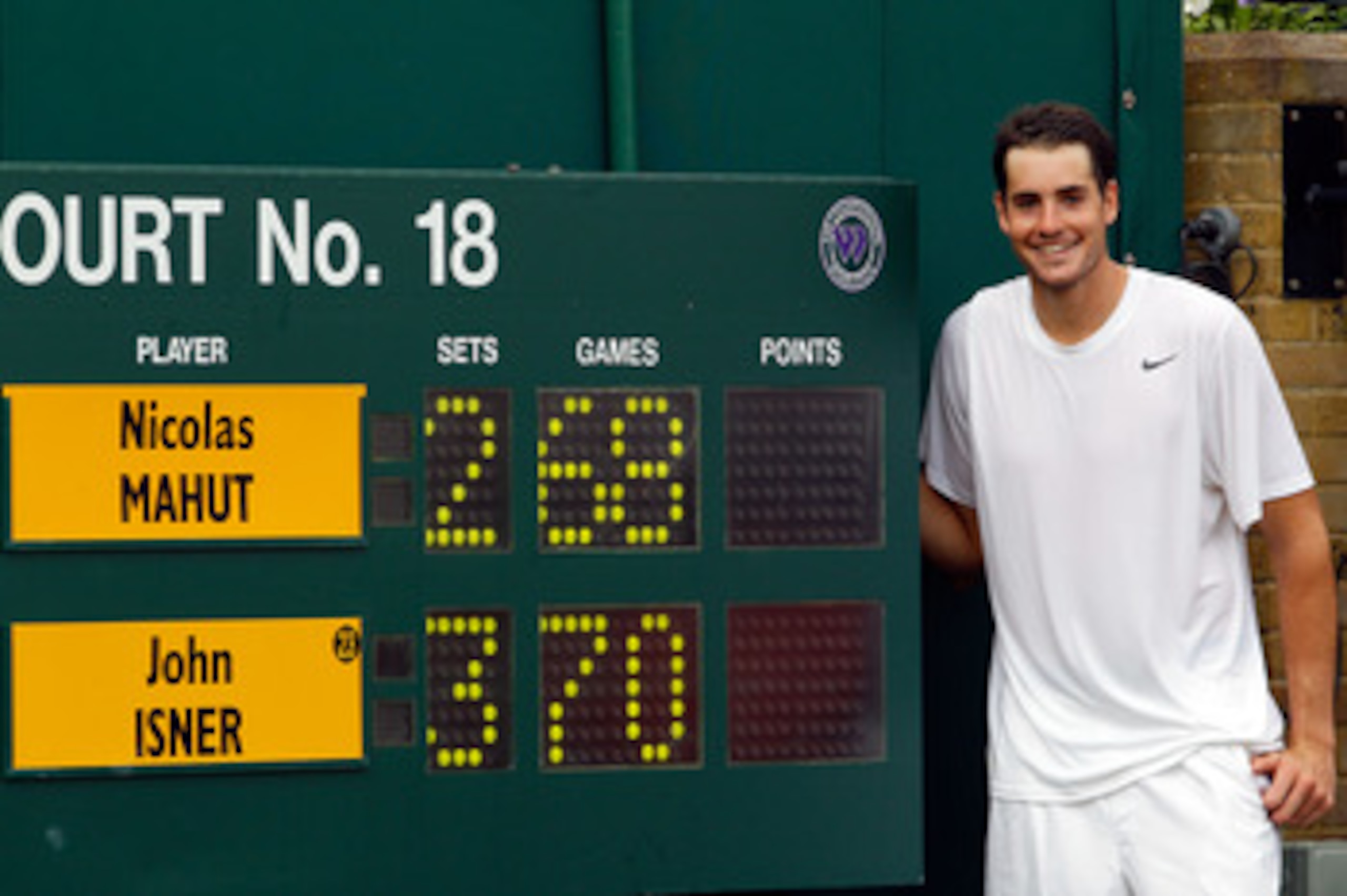 LONDON, ENGLAND - JUNE 24: John Isner of USA celebrates winning on the third day of his first round match against Nicolas Mahut of France on Day Four of the Wimbledon Lawn Tennis Championships at the All England Lawn Tennis and Croquet Club on June 24, 2 LONDON, ENGLAND - JUNE 24: John Isner of USA celebrates winning on the third day of his first round match against Nicolas Mahut of France on Day Four of the Wimbledon Lawn Tennis Championships at the All England Lawn Tennis and Croquet Club on June 24, 2