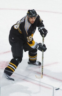 WASHINGTON - DECEMBER 22:  Defenseman Michal Rozsival #28 of the Pittsburgh Penguins passes the puck during the NHL game against the Washington Capitals at the MCI Center in Washington D.C. on December 22, 2001.  The Penguins tied the Capitals 4-4.  (Phot