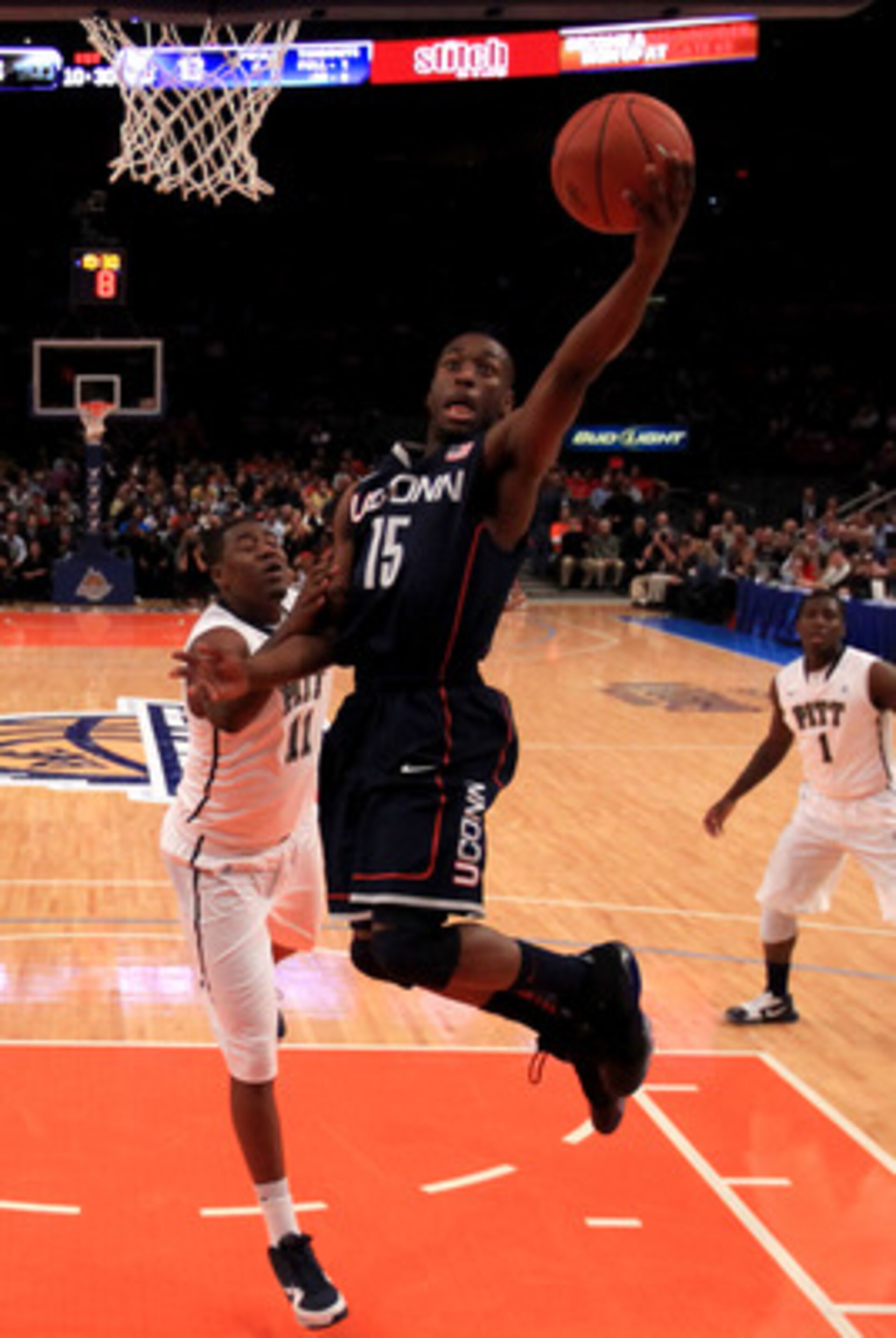 NEW YORK, NY - MARCH 10: Kemba Walker #15 of the Connecticut Huskies drives to the basket against Dante Taylor #11 of the Pittsburgh Panthers during the quarterfinals of the 2011 Big East Men's Basketball Tournament presented by American Eagle Outfitters 