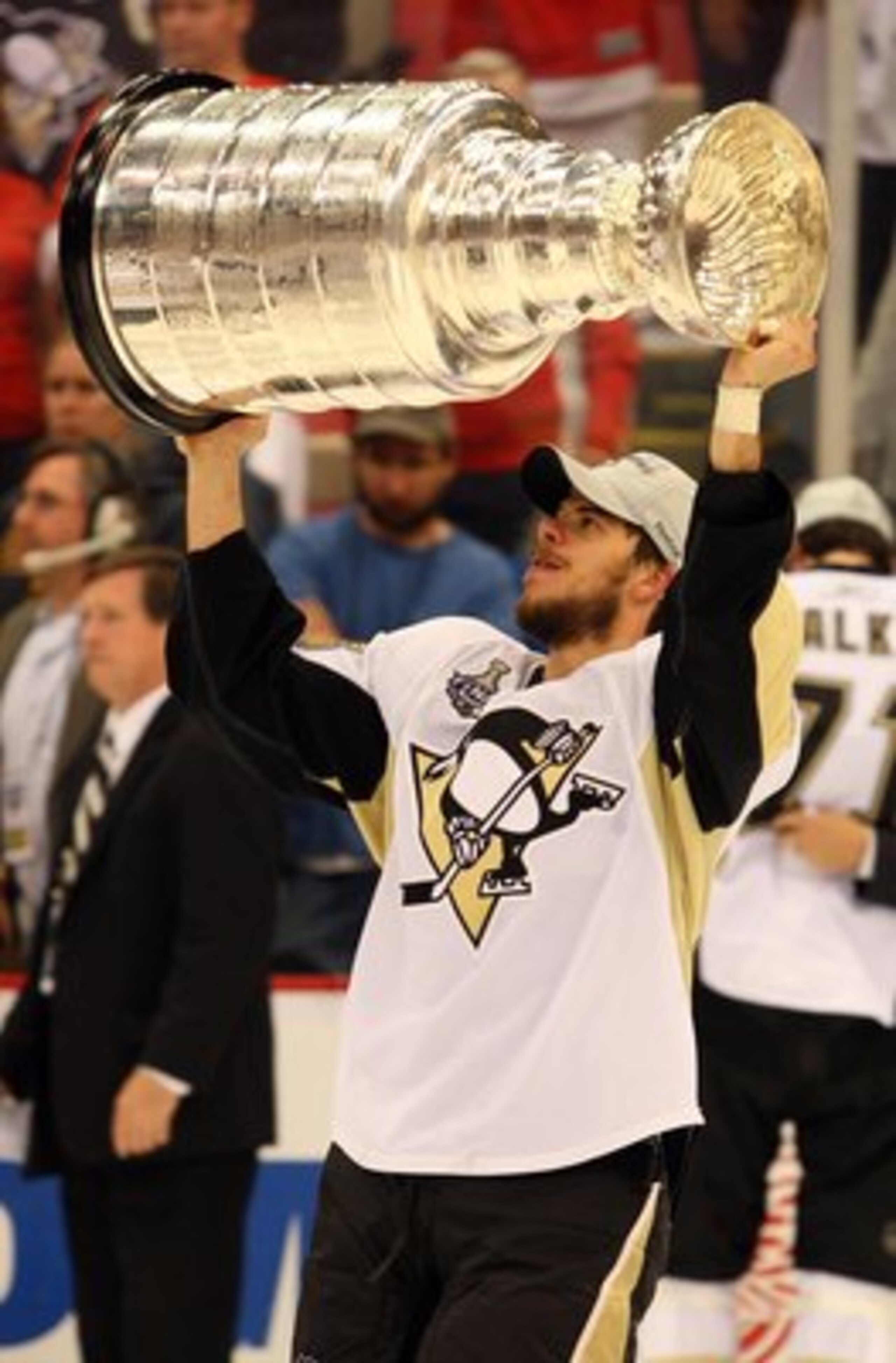 DETROIT - JUNE 12:  Tyler Kennedy #48 of the Pittsburgh Penguins celebrates with the Stanley Cup after defeating the Detroit Red Wings by a score of 2-1 to win Game Seven and the 2009 NHL Stanley Cup Finals at Joe Louis Arena on June 12, 2009 in Detroit, 