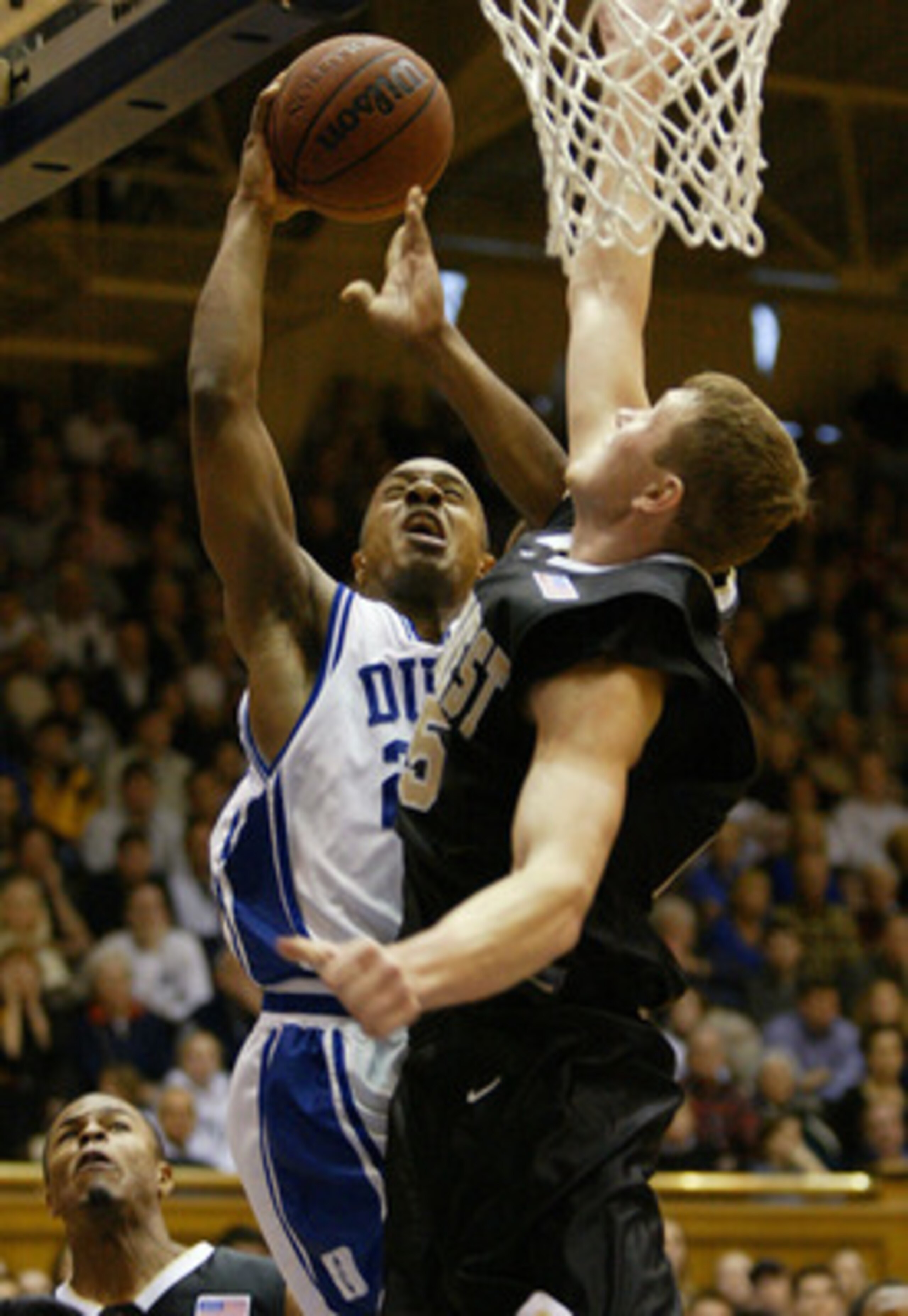 19 Jan 2002:  Jason Williams #22 of Duke shoots over Darius Songaila #25 of Wake during the second half of the Wake Forest Demon Deacons versus Duke Blue Devils game at Cameron Indoor Stadium in Durham, North Carolina.   Digital Image. Mandatory Credit:Cr