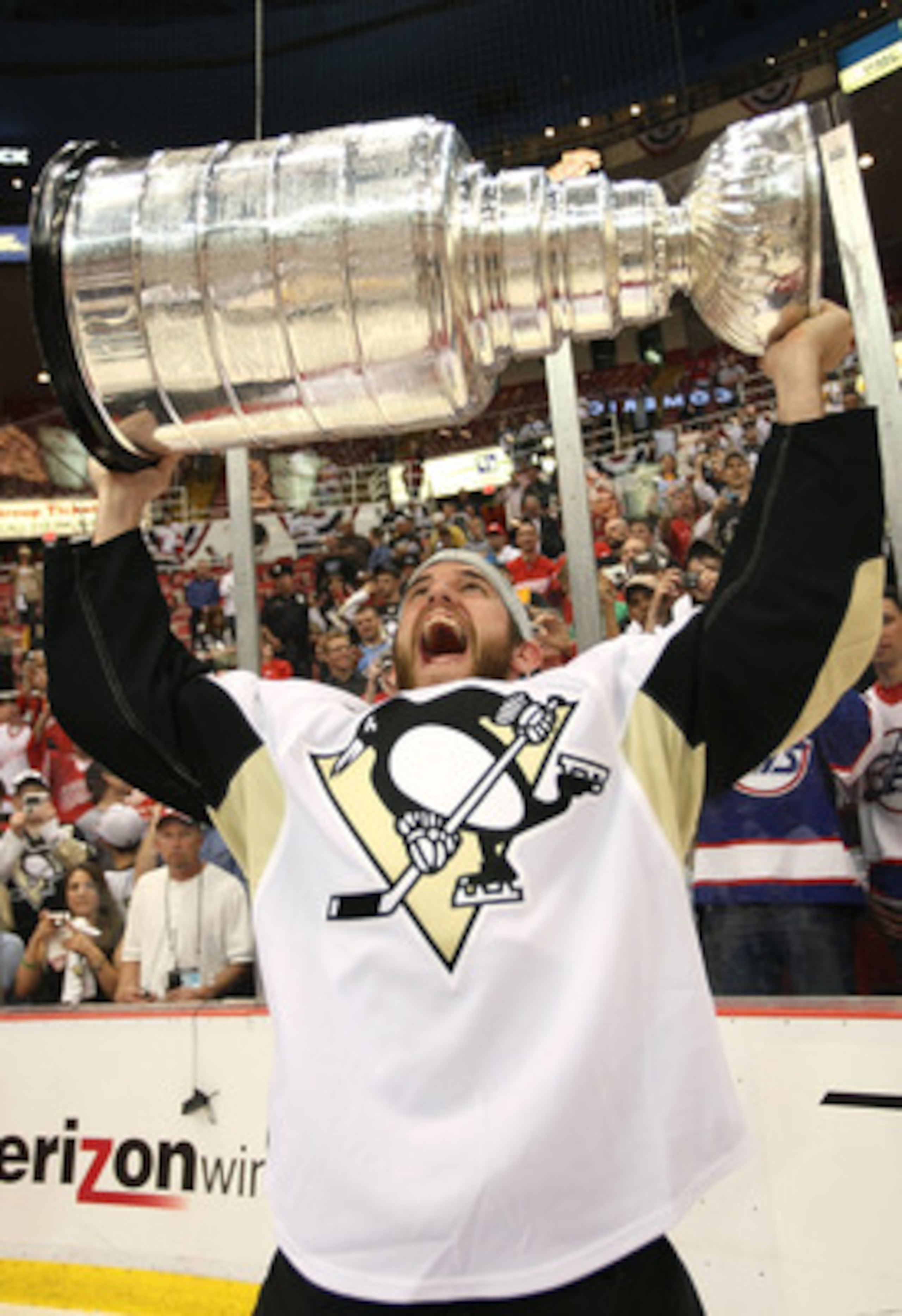 DETROIT - JUNE 12:  Alex Goligoski #3 of the Pittsburgh Penguins celebrates with the Stanley Cup after defeating the Detroit Red Wings by a score of 2-1 to win Game Seven and the 2009 NHL Stanley Cup Finals at Joe Louis Arena on June 12, 2009 in Detroit, 