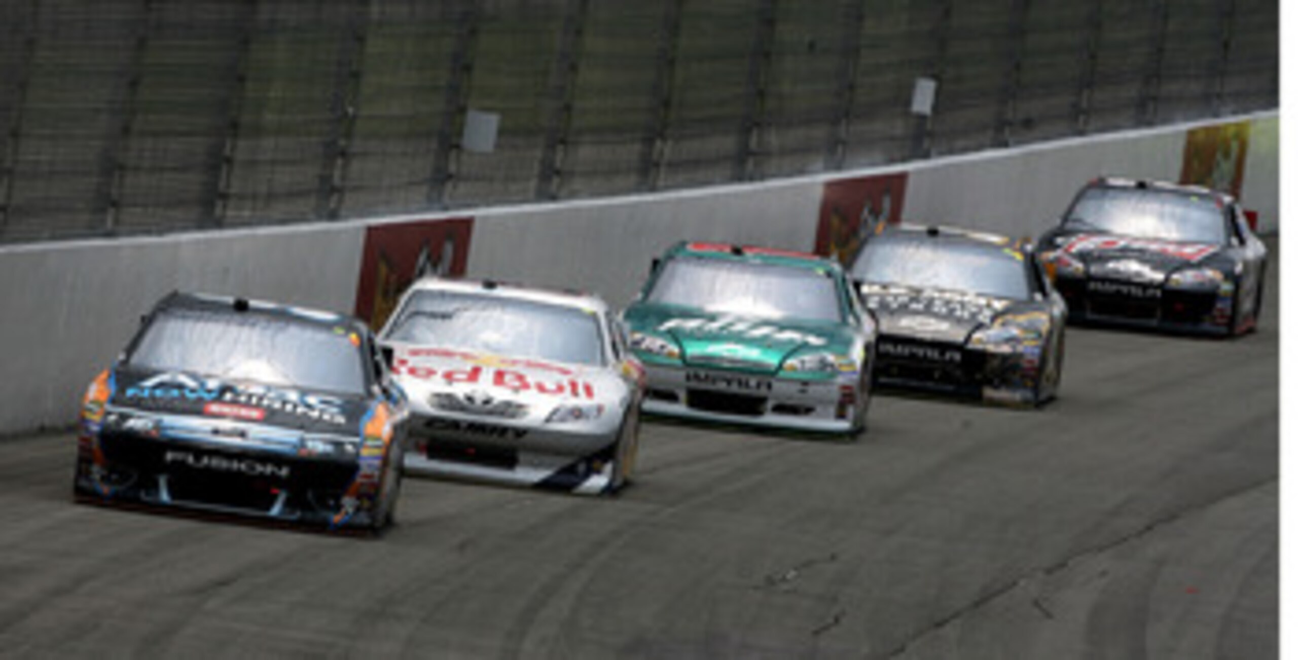 BROOKLYN, MI - JUNE 19:  Carl Edwards, driver of the #99 Aflac Ford, leads Brian Vickers, driver of the #83 Red Bull Toyota, Dale Earnhardt Jr., driver of the #88 Amp Energy/National Guard Chevrolet, Ryan Newman, driver of the #39 U.S. Army 236th Birthday