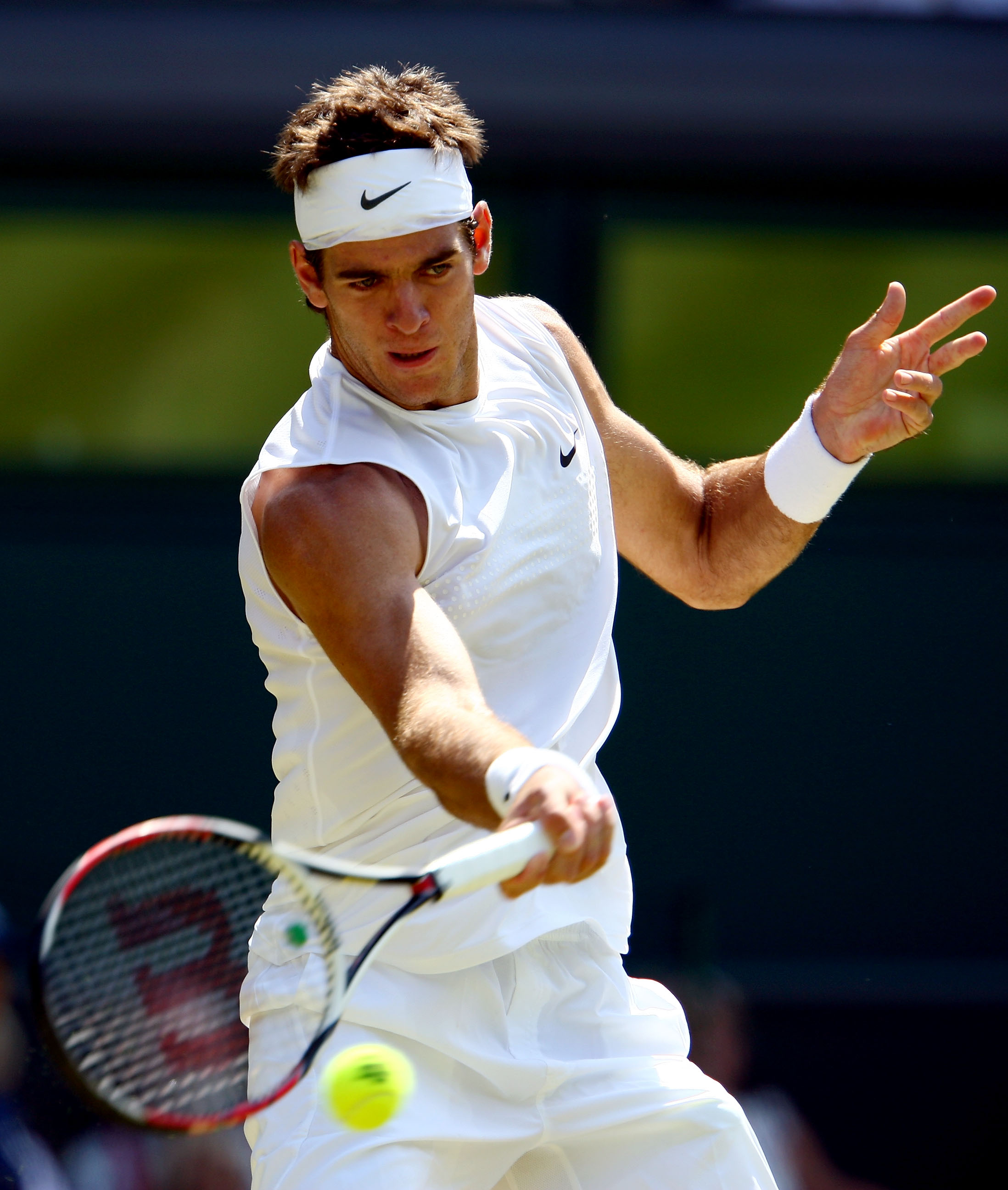 WIMBLEDON, ENGLAND - JUNE 25:  Juan Martin Del Potro of Argentina plays a forehand during the men's singles second round match against Lleyton Hewitt of Australia on Day Four of the Wimbledon Lawn Tennis Championships at the All England Lawn Tennis and Cr