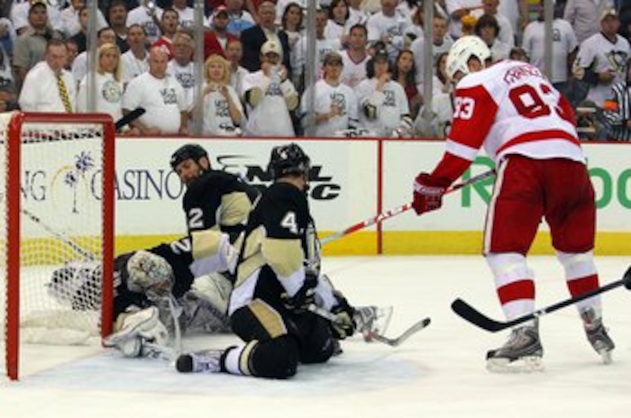 PITTSBURGH - JUNE 09:  Johan Franzen #93 of the Detroit Red Wings has his shot blocked by Rob Scuderi #4 of the Pittsburgh Penguins late in Game Six of the NHL Stanley Cup Finals at the Mellon Arena on June 9, 2009 in Pittsburgh, Pennsylvania.  (Photo by 