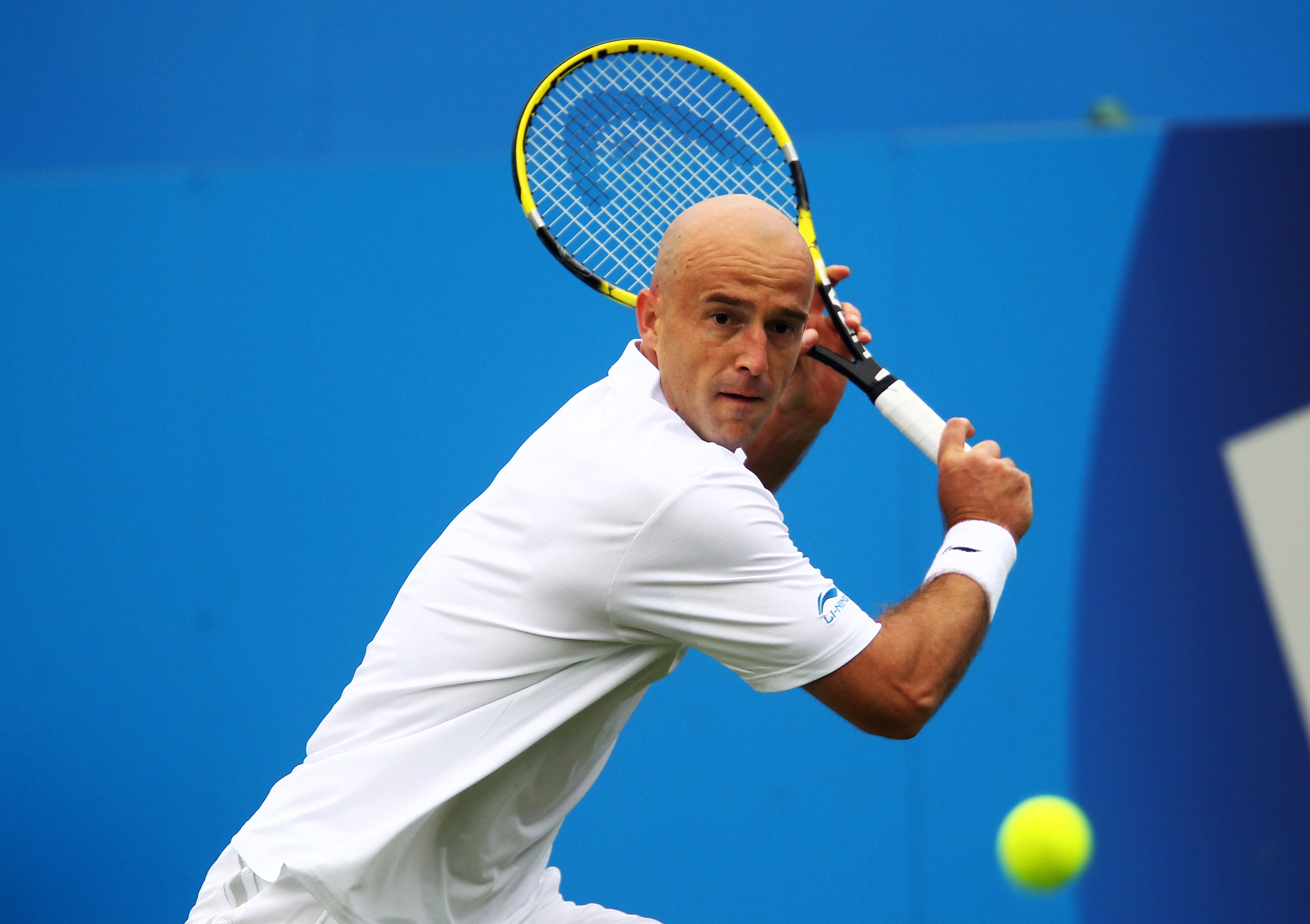 LONDON, ENGLAND - JUNE 06:  Ivan Ljubicic of Croatia eyes the ball during his Men's Singles first round match against Ryan Sweeting of the United States on day one of the AEGON Championships at Queens Club on June 6, 2011 in London, England.  (Photo by Ju