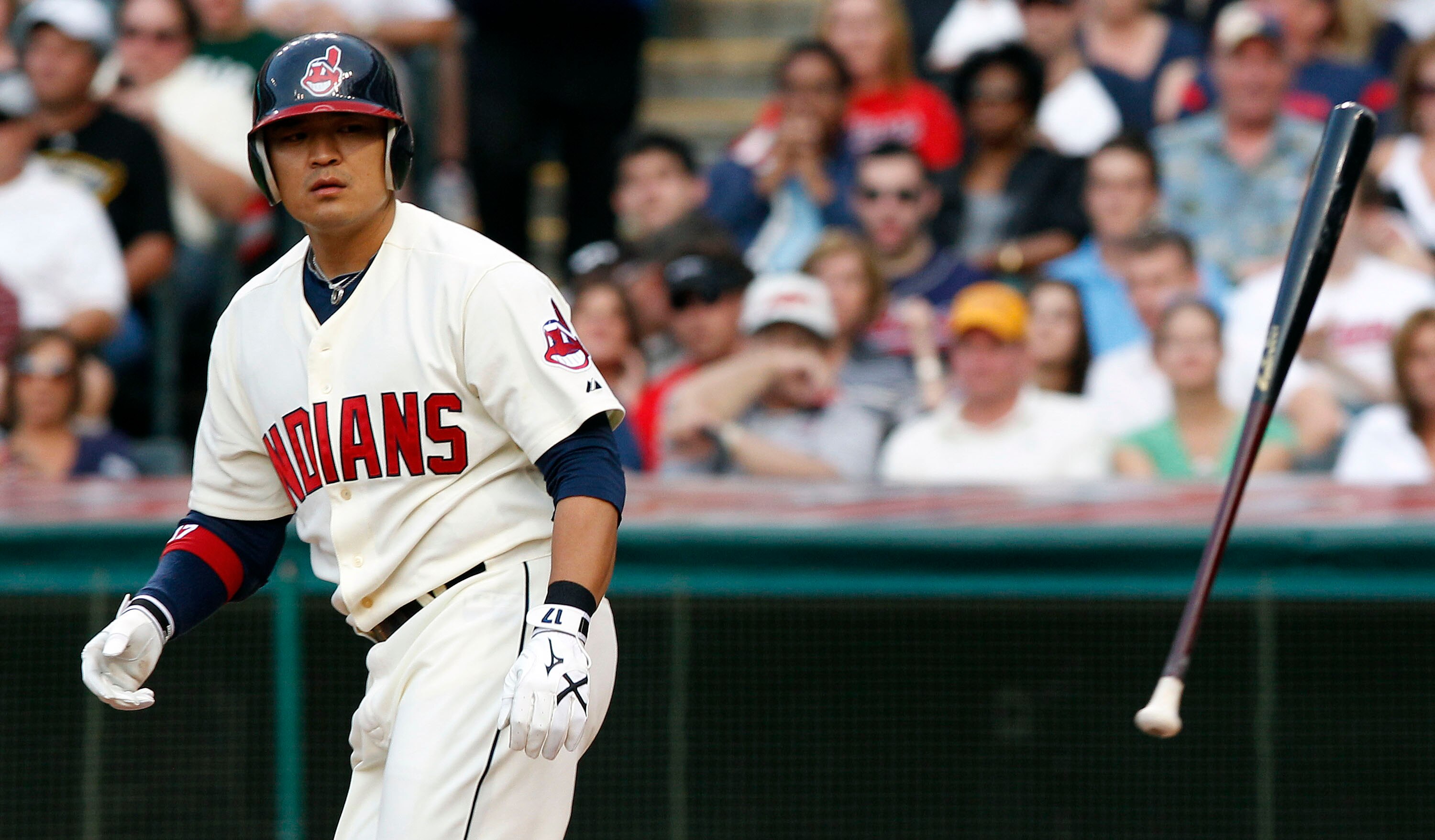 CLEVELAND, OH - JUNE 18:   Shin-Soo Choo #17 of the Cleveland Indians tosses his bat after being walked during the third inning against  the Pittsburgh Pirates in their game on June 18, 2011 at Progressive Field in Cleveland, Ohio.  The Indians defeated t