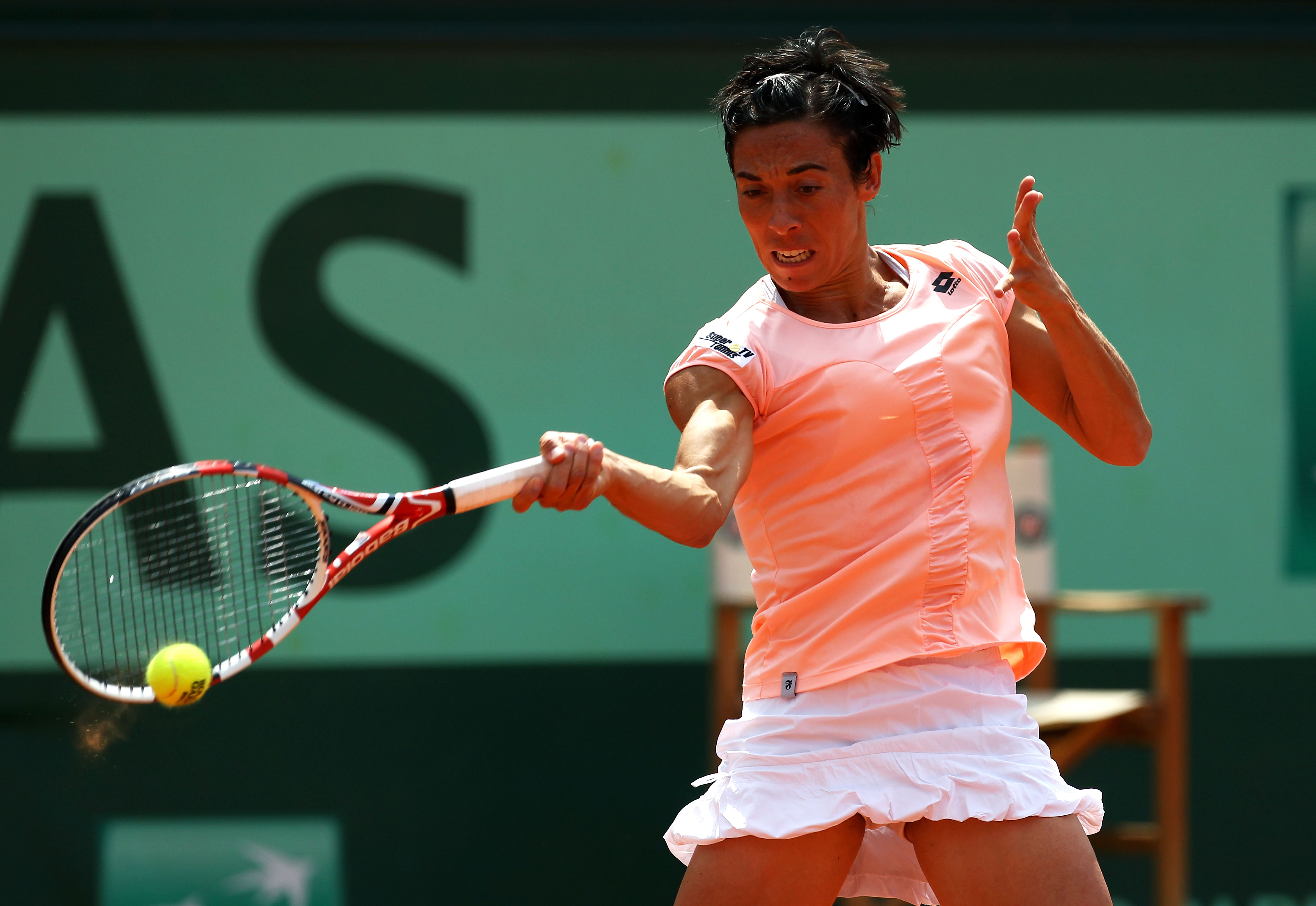 PARIS, FRANCE - JUNE 04:  Francesca Schiavone of Italy hits a forehand during the women's singles final match between Francesca Schiavone of Italy and Na Li of China on day fourteen of the French Open at Roland Garros on June 4, 2011 in Paris, France.  (P