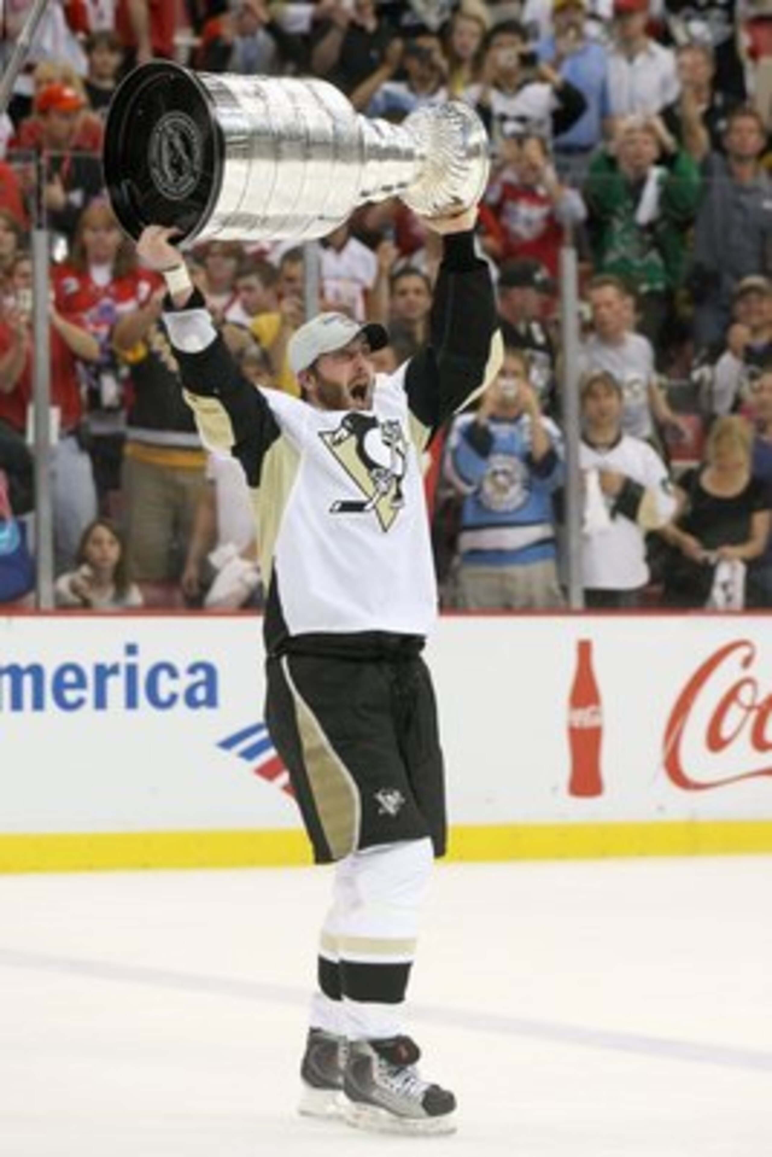 DETROIT - JUNE 12: Brooks Orpik #44 of the Pittsburgh Penguins celebrates with the Stanley Cup after defeating the Detroit Red Wings by a score of 2-1 to win Game Seven and the 2009 NHL Stanley Cup Finals at Joe Louis Arena on June 12, 2009 in Detroit, Mi