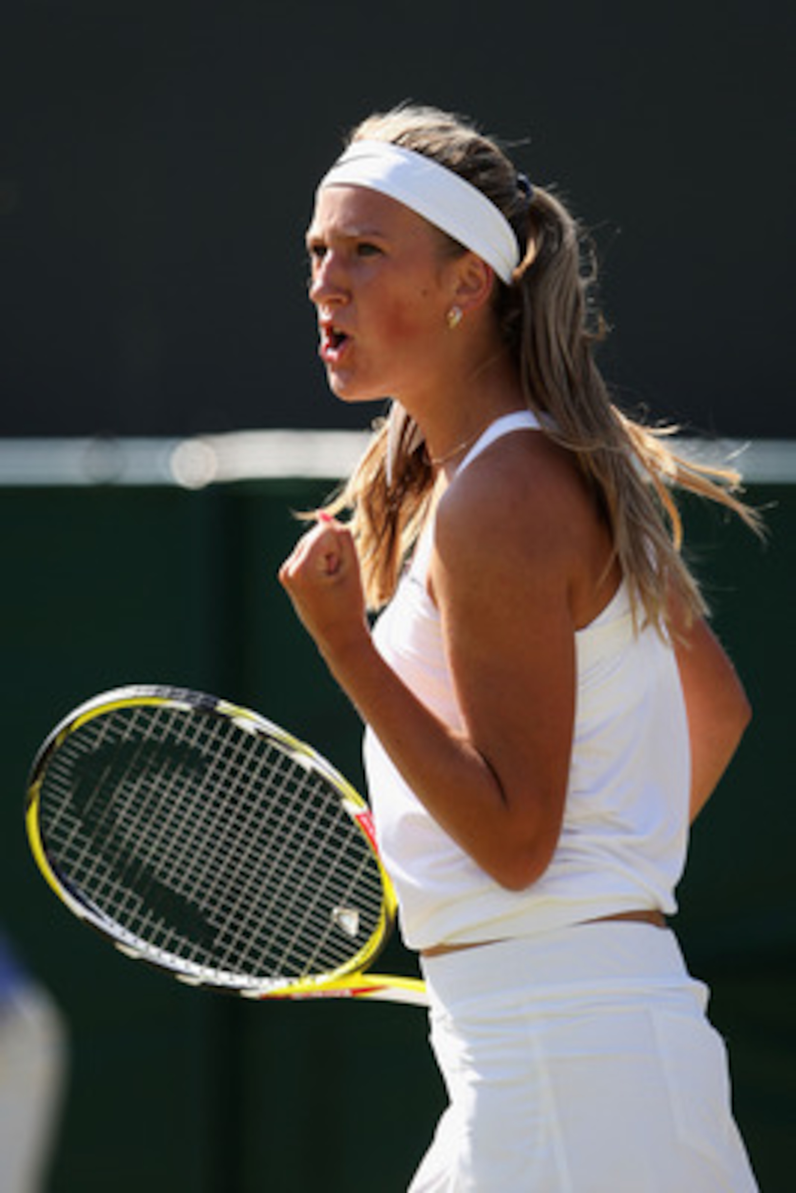 WIMBLEDON, ENGLAND - JUNE 24: Victoria Azarenka of Belarus reacts during the women's singles second round match against Ioana Olaru of Romania on Day Three of the Wimbledon Lawn Tennis Championships at the All England Lawn Tennis and Croquet Club on June WIMBLEDON, ENGLAND - JUNE 24: Victoria Azarenka of Belarus reacts during the women's singles second round match against Ioana Olaru of Romania on Day Three of the Wimbledon Lawn Tennis Championships at the All England Lawn Tennis and Croquet Club on June