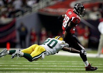ATLANTA - NOVEMBER 13:  Mark Roman #20 of the Green Bay Packers chases down Warrick Dunn #28 of the Atlanta Falcons during their game on November 13, 2005 at the Georgia Dome in Atlanta, Georgia.  (Photo By Streeter Lecka)