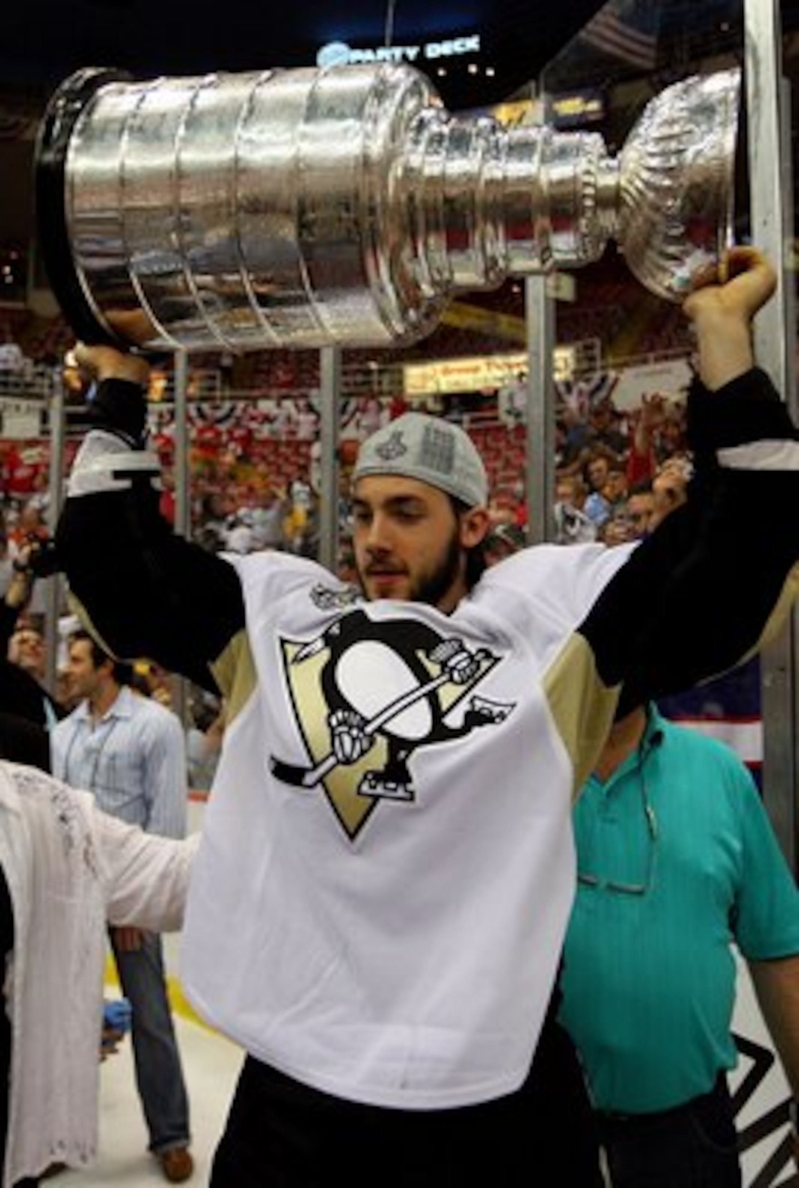 DETROIT - JUNE 12:  Kris Letang #58 of the Pittsburgh Penguins celebrates with the Stanley Cup after defeating the Detroit Red Wings by a score of 2-1 to win Game Seven and the 2009 NHL Stanley Cup Finals at Joe Louis Arena on June 12, 2009 in Detroit, Mi