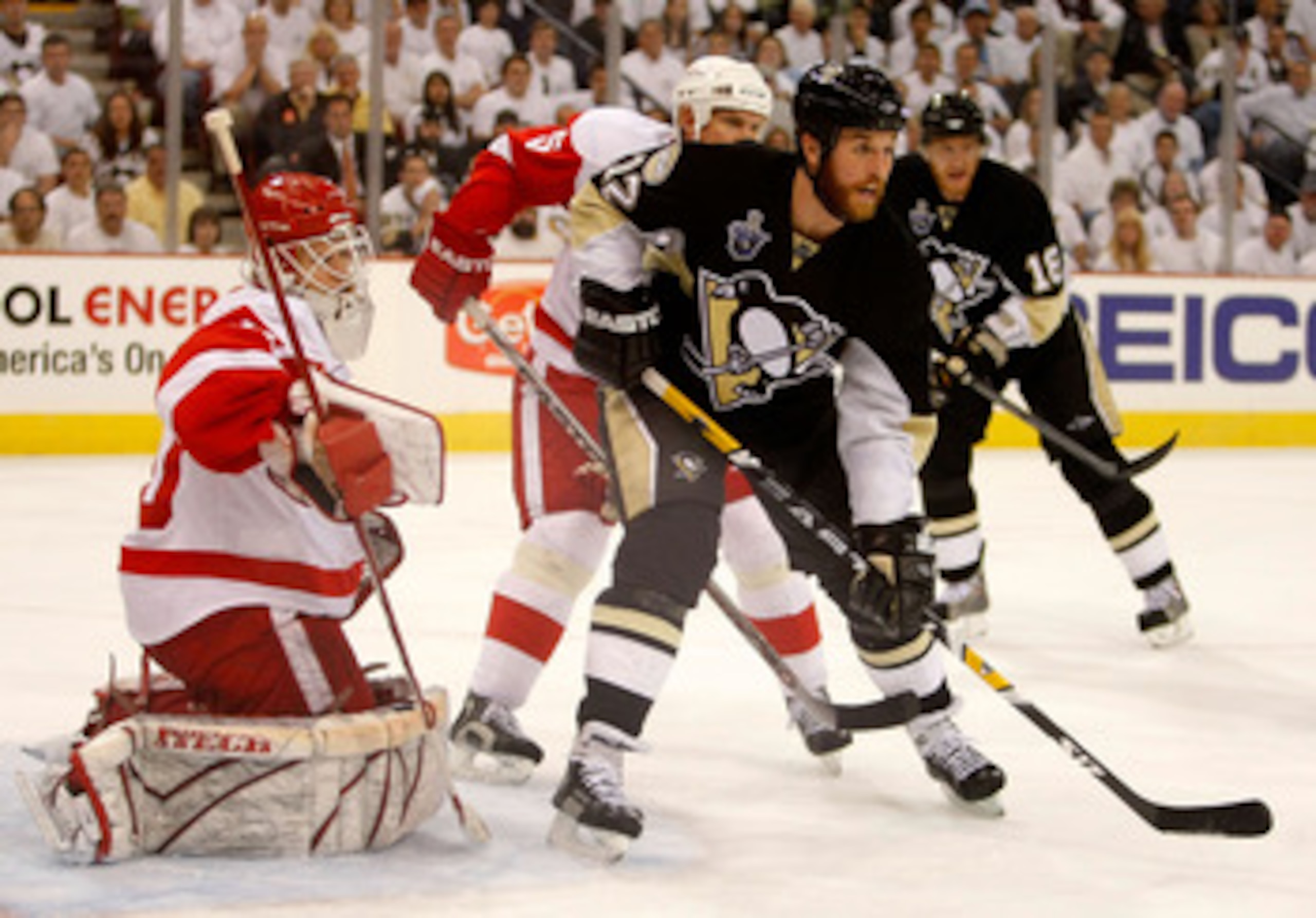 PITTSBURGH - MAY 31:  Ryan Malone #12 of the Pittsburgh Penguins sets up in front of goaltender Chris Osgood #30 and Nicklas Lidstrom #5 of the Detroit Red Wings  during game four of the 2008 NHL Stanley Cup Finals at Mellon Arena on May 31, 2008 in Pitts