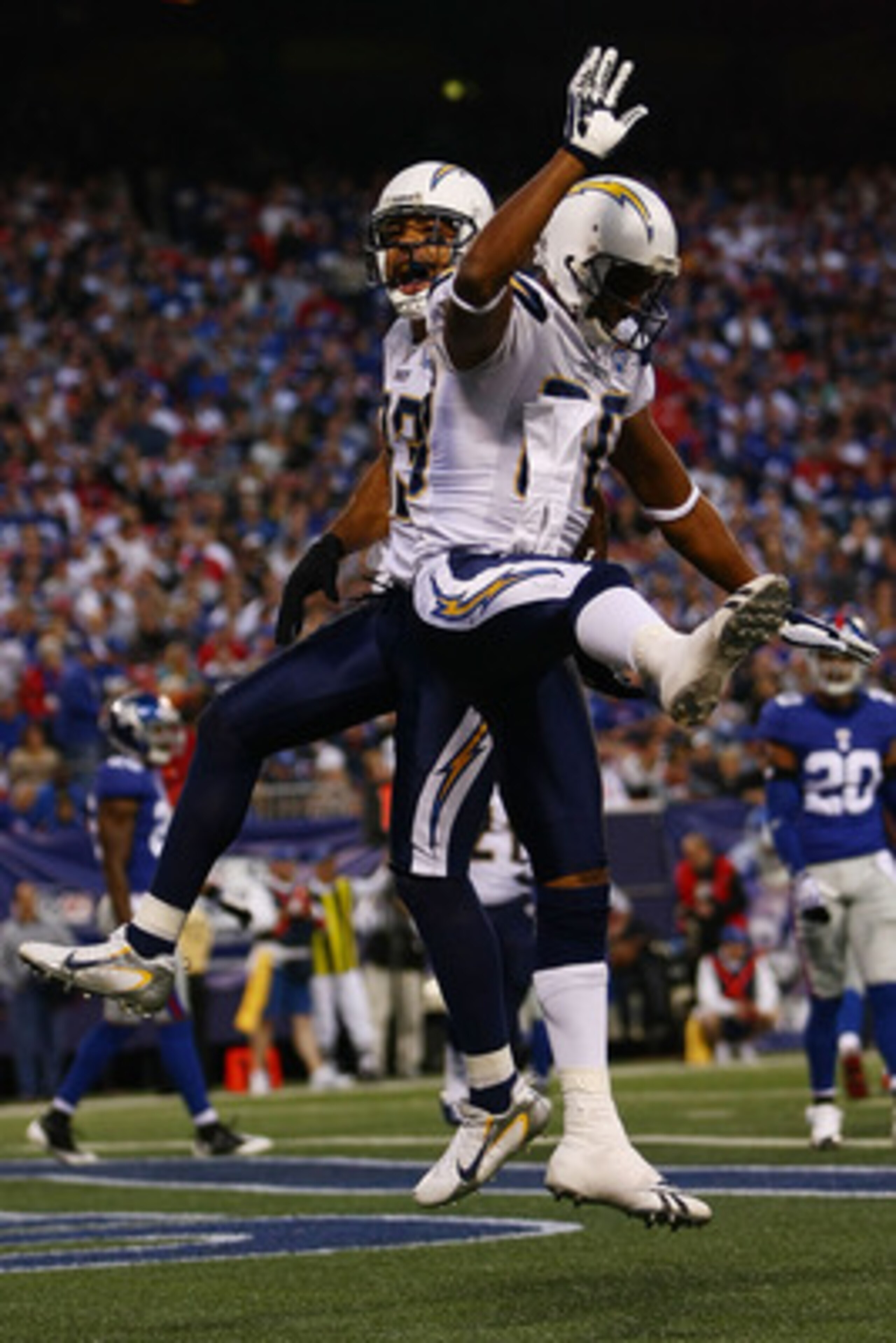 EAST RUTHERFORD, NJ - NOVEMBER 08:  Vincent Jackson #83 of the San Diego Chargers celebrates his touchdown with teammate Malcolm Floyd #80 against  the New York Giants on November 8, 2009 at Giants Stadium in East Rutherford, New Jersey.  (Photo by Chris