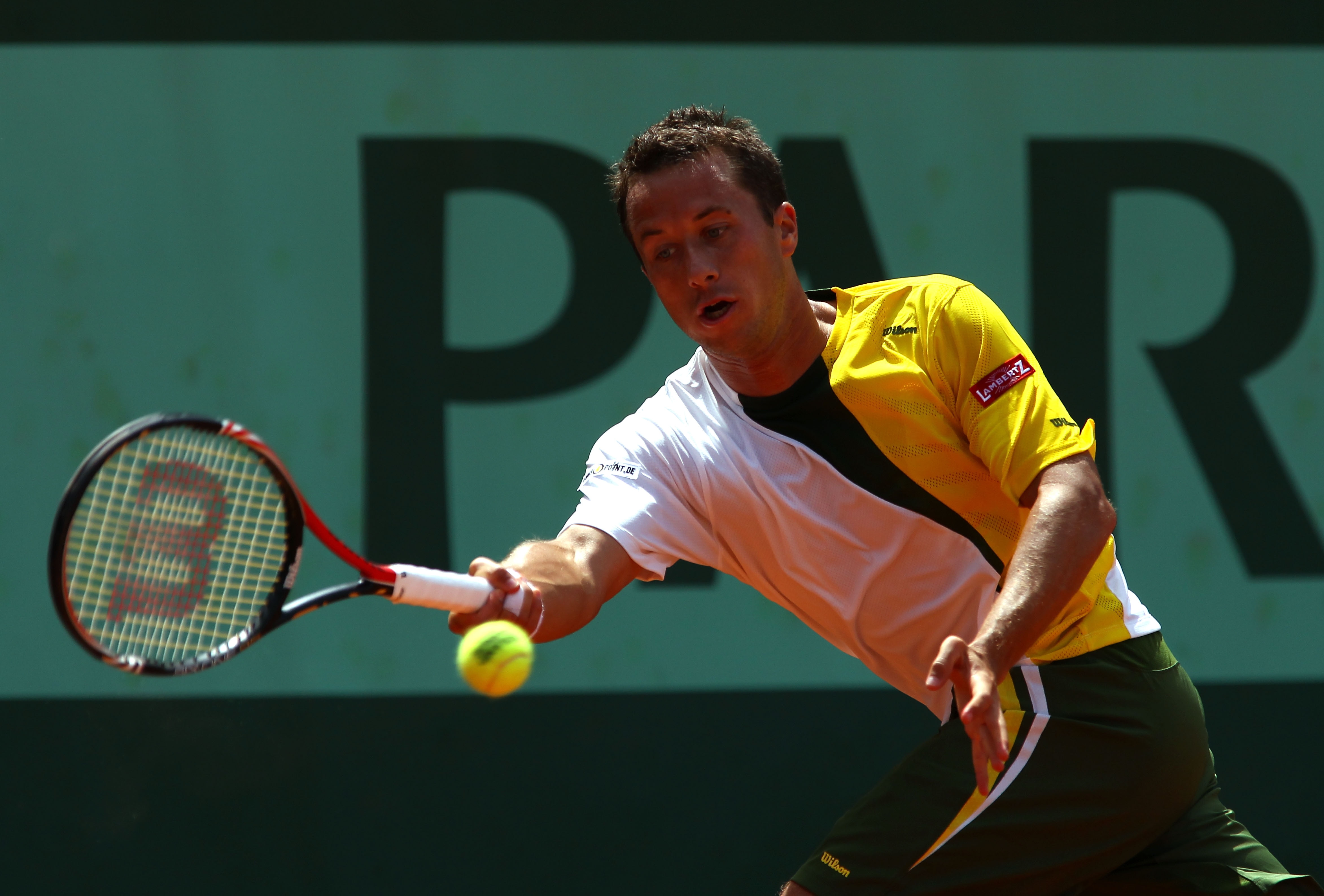 PARIS, FRANCE - MAY 24:  Philipp Kohlschreiber of Germany plays a forehand during the men's singles round one match between Sam Querrey of USA and Philipp Kohlschreiber of Germany on day three of the French Open at Roland Garros on May 24, 2011 in Paris,