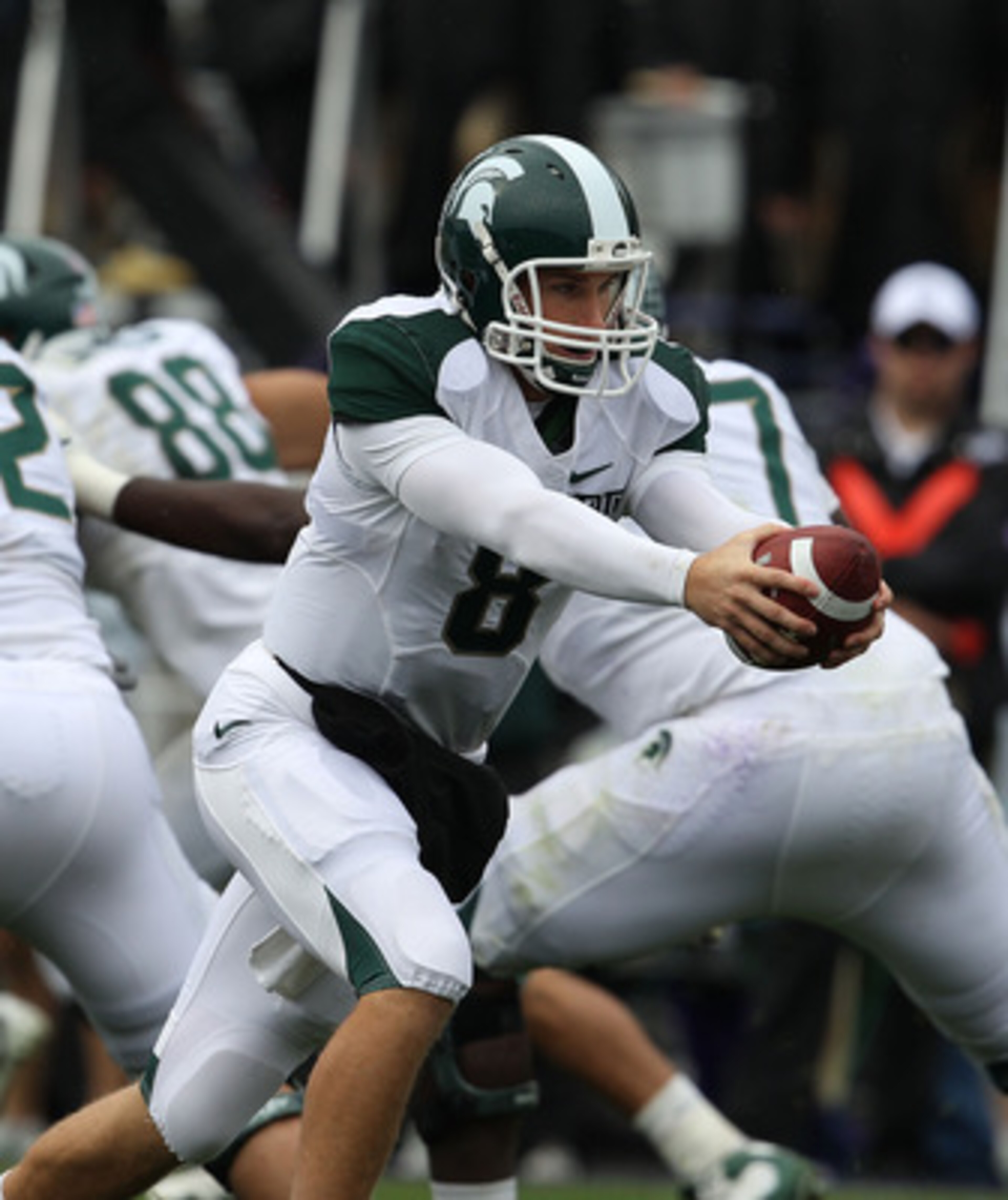 EVANSTON, IL - OCTOBER 23: Kirk Cousins #8 of the Michigan State Spartans turns to hand-off against the Northwestern Wildcats at Ryan Field on October 23, 2010 in Evanston, Illinois. Michigan State defeated Northwestern 35-27. (Photo by Jonathan Daniel/Ge