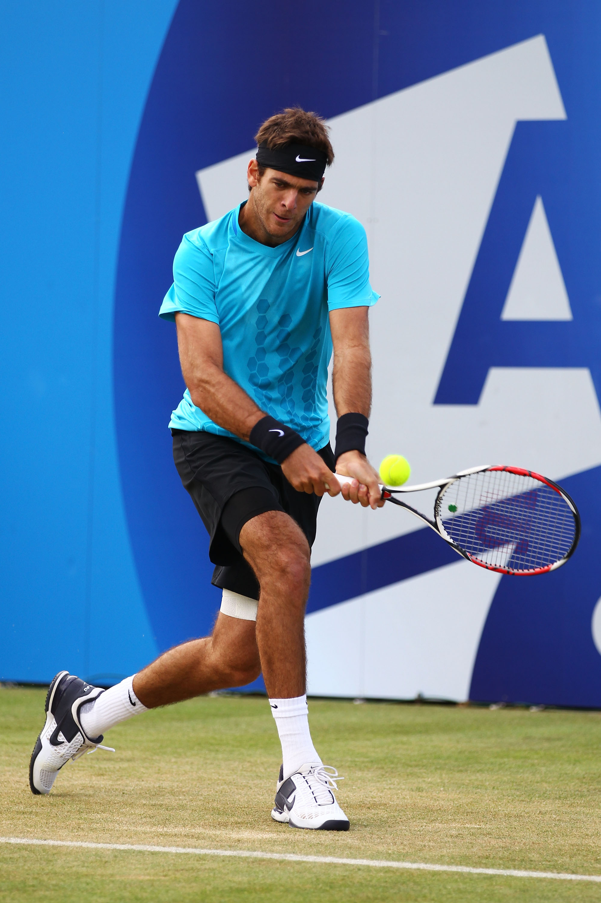 LONDON, ENGLAND - JUNE 09:  Juan Martin del Potro of Argentina returns a shot during his Men's Singles third round match against Adrian Mannarino of France on day four of the AEGON Championships at Queens Club on June 9, 2011 in London, England.  (Photo b
