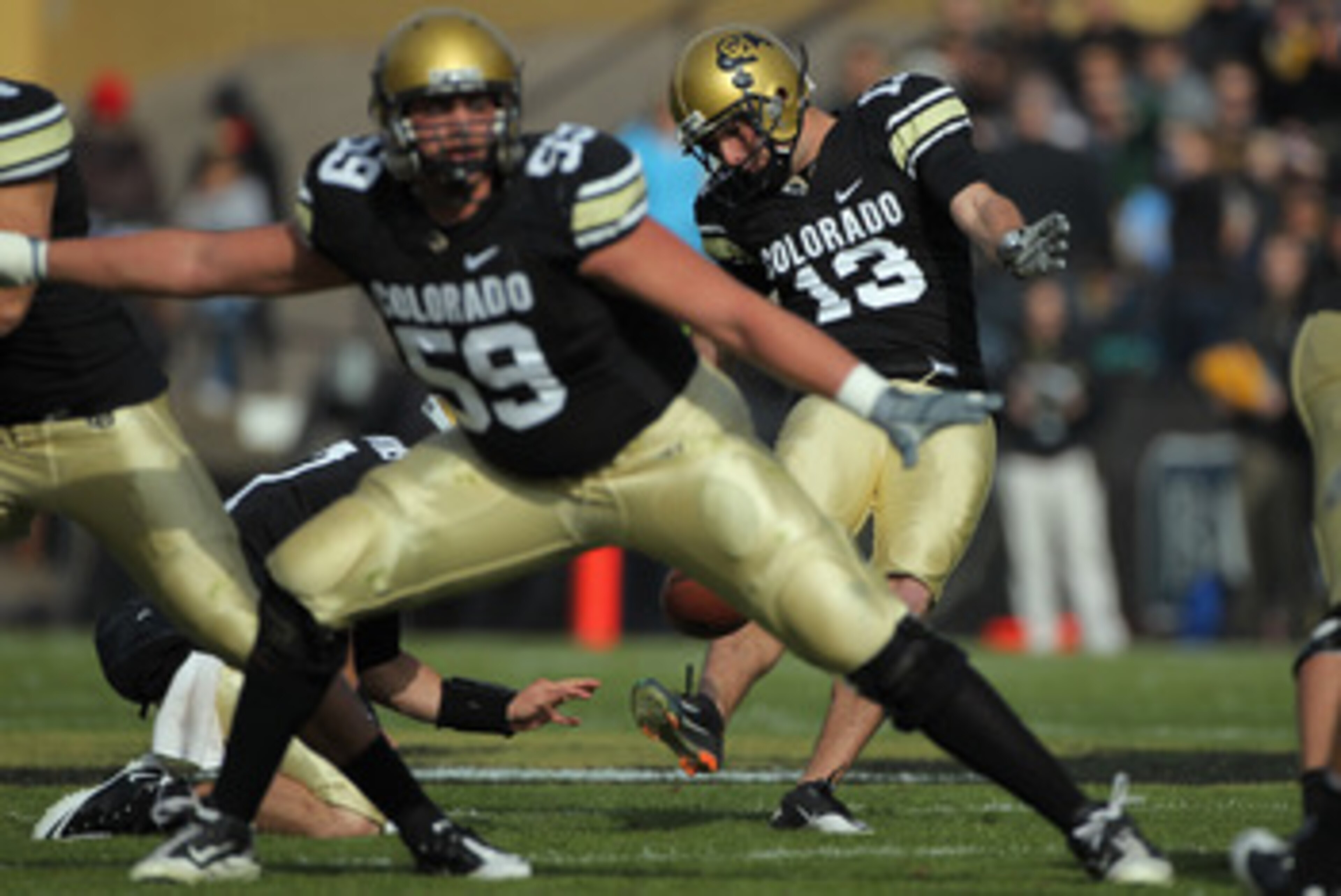BOULDER, CO - NOVEMBER 20:  Place kicker Aric Goodman #13 of the Colorado Buffaloes kicks a field goal against the Kansas State Wildcats at Folsom Field on November 20, 2010 in Boulder, Colorado.  (Photo by Doug Pensinger/Getty Images)