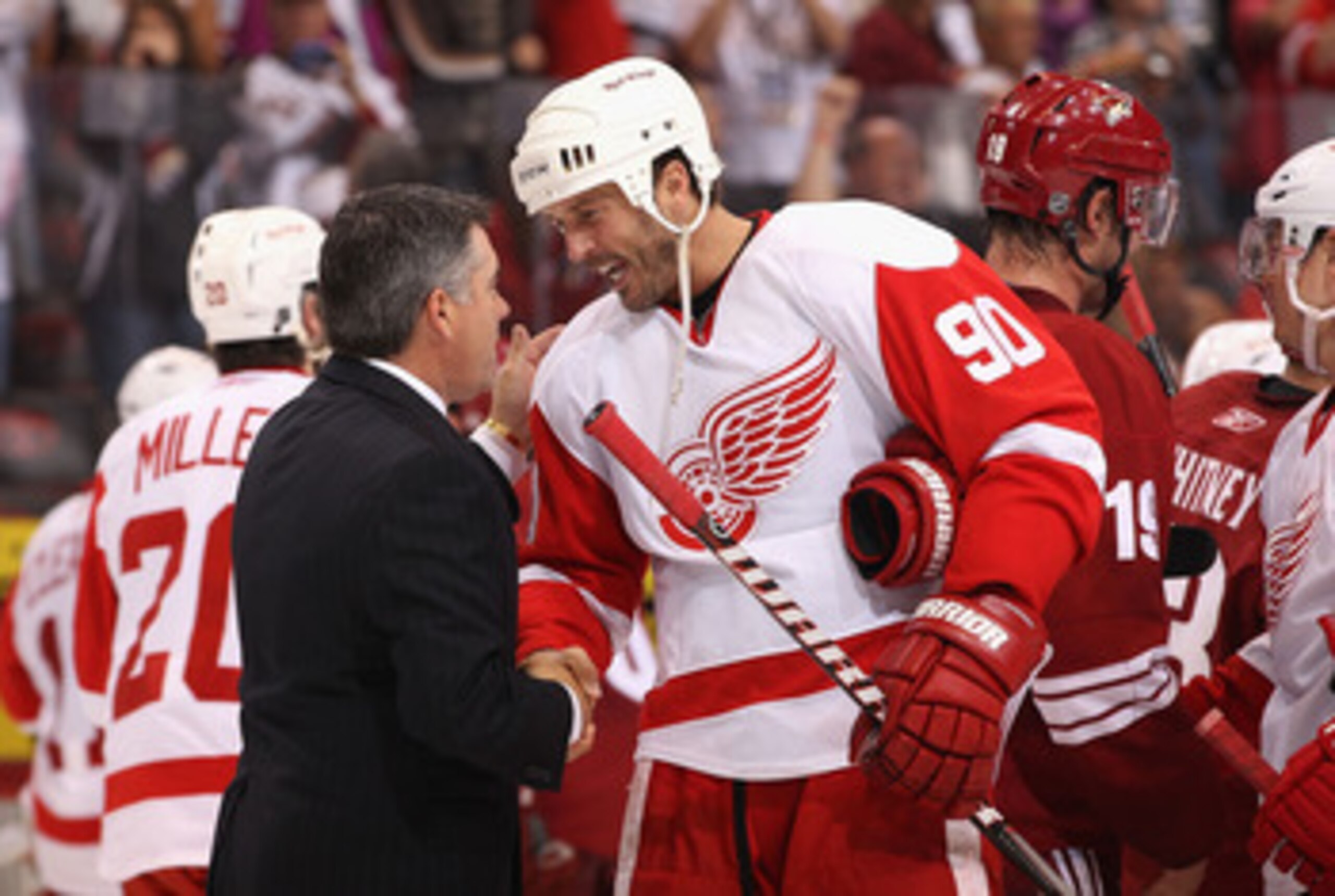 GLENDALE, AZ - APRIL 20:  Mike Modano #90 of the Detroit Red Wings shakes hands with head coach Dave Tippett of the Phoenix Coyotes following Game Four of the Western Conference Quarterfinals during the 2011 NHL Stanley Cup Playoffs at Jobing.com Arena on