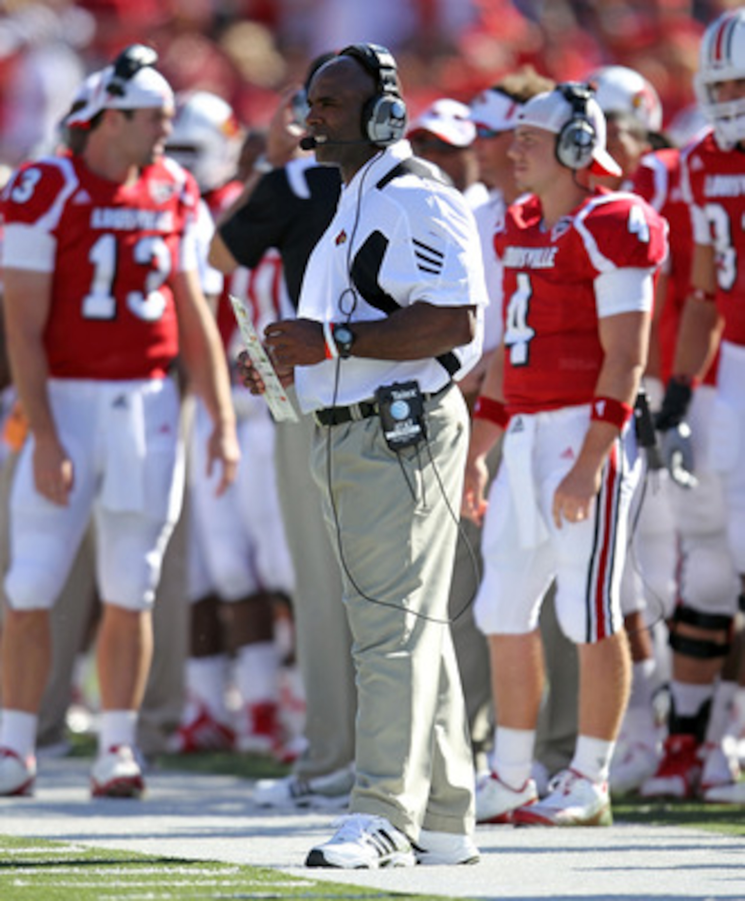 LOUISVILLE, KY - SEPTEMBER 04: Charlie Strong the Head Coach of the Louisville Cardinals gives instructions to his team during the game against the  Kentucky Wildcats at Papa John's Cardinal Stadium on September 4, 2010 in Louisville, Kentucky.  (Photo by