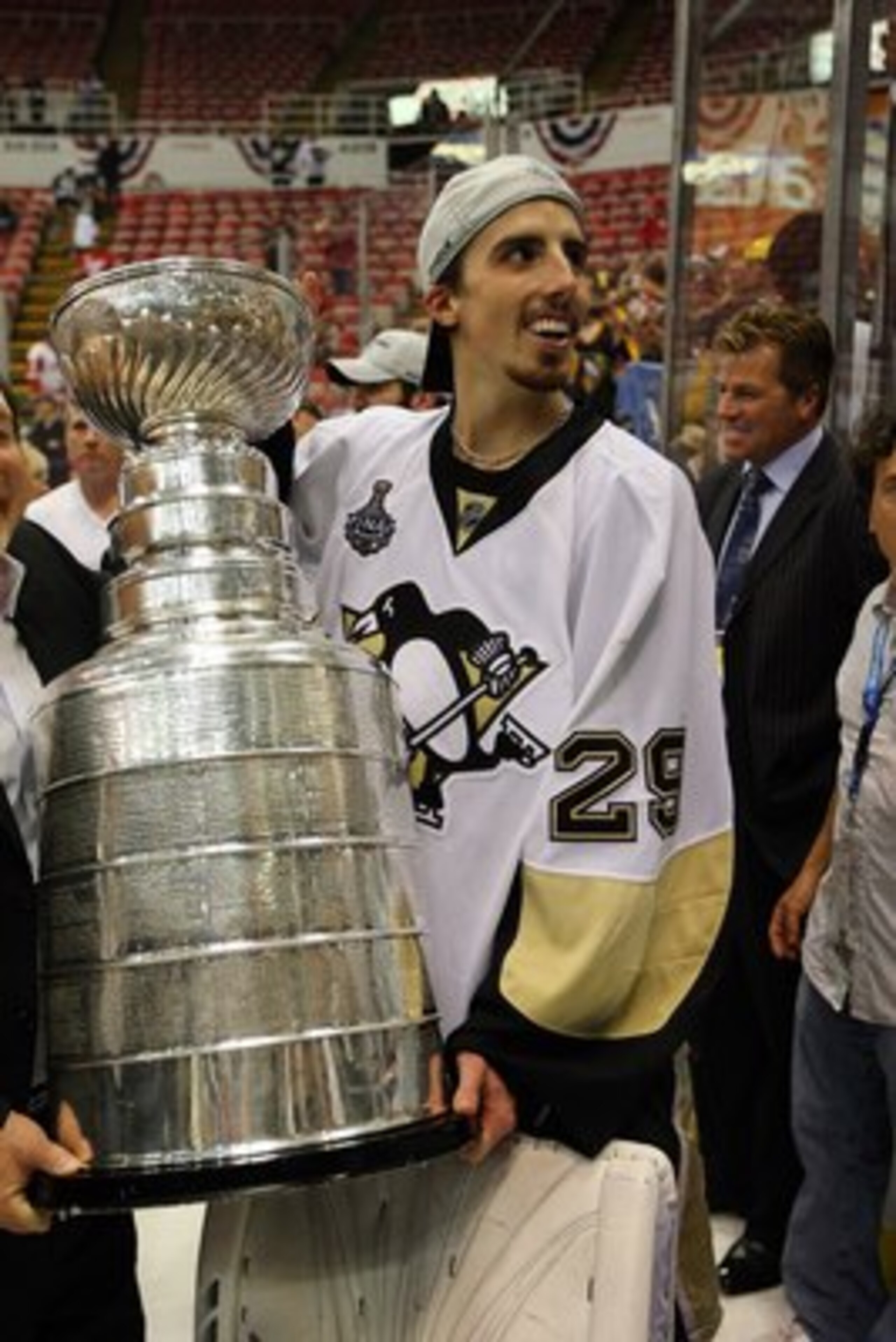 DETROIT - JUNE 12:  Marc-Andre Fleury #29 of the Pittsburgh Penguins celebrates with the Stanley Cup after defeating the Detroit Red Wings by a score of 2-1 to win Game Seven and the 2009 NHL Stanley Cup Finals at Joe Louis Arena on June 12, 2009 in Detro