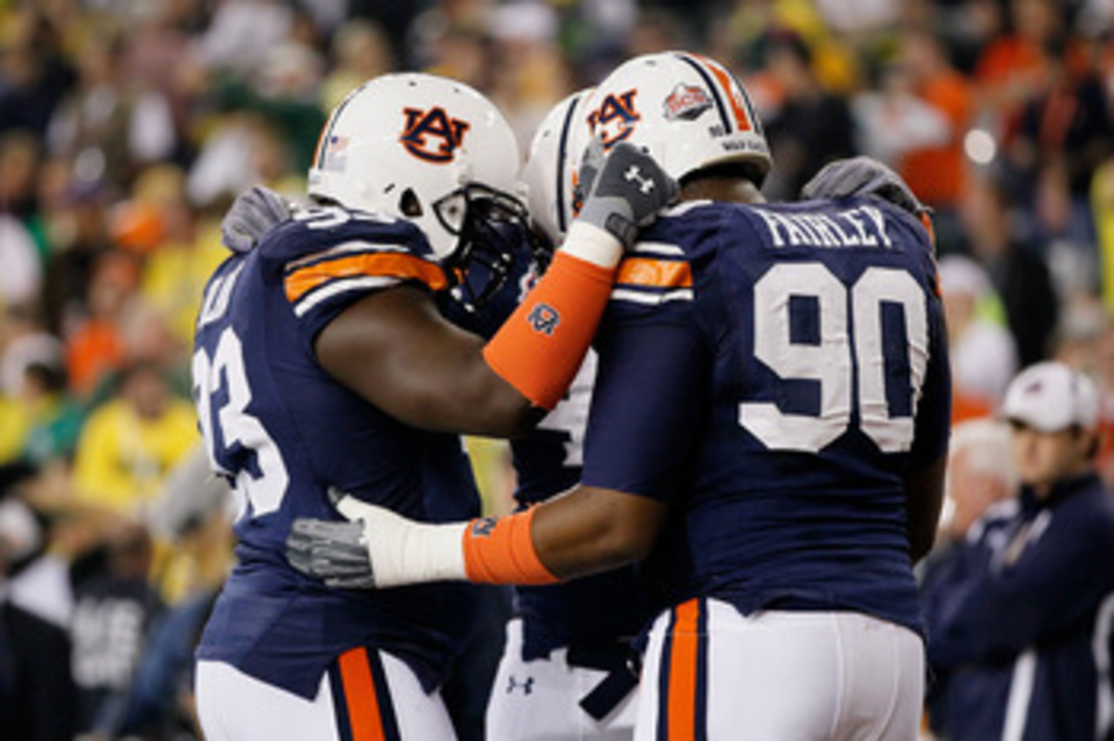 GLENDALE, AZ - JANUARY 10:  Nick Fairley #90 of the Auburn Tigers huddles with members of the Tigers defense during the Tostitos BCS National Championship Game at University of Phoenix Stadium on January 10, 2011 in Glendale, Arizona.  (Photo by Kevin C. 